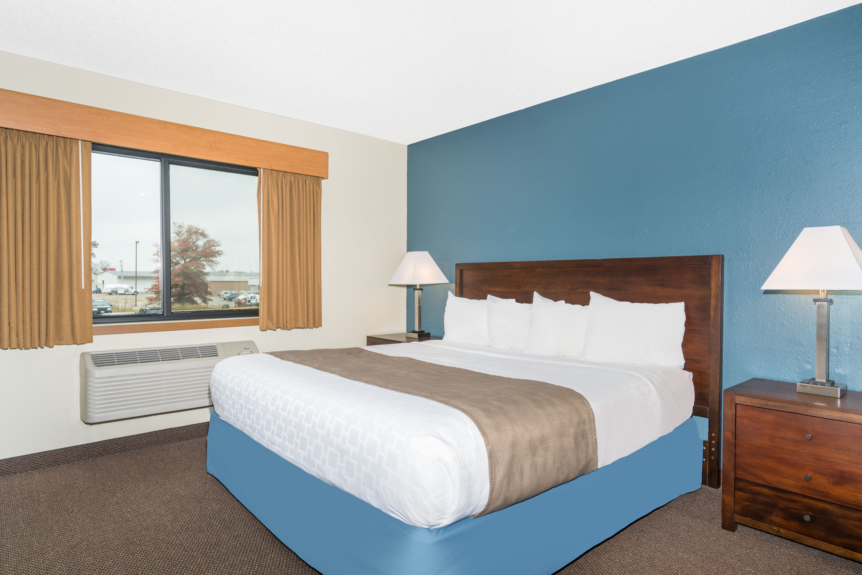 Guest room at the Days Inn & Suites by Wyndham Baxter Brainerd Area in Baxter, Minnesota