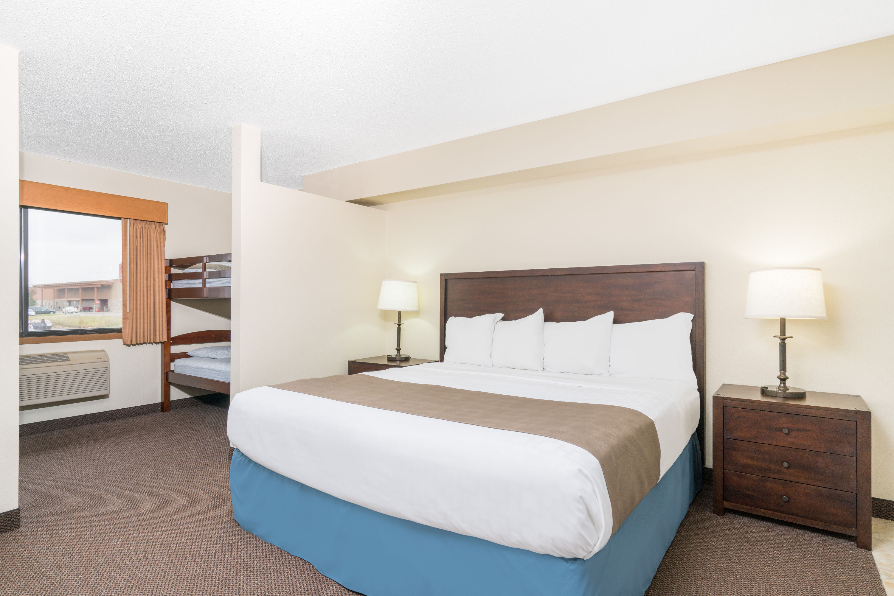 Guest room at the Days Inn & Suites by Wyndham Baxter Brainerd Area in Baxter, Minnesota