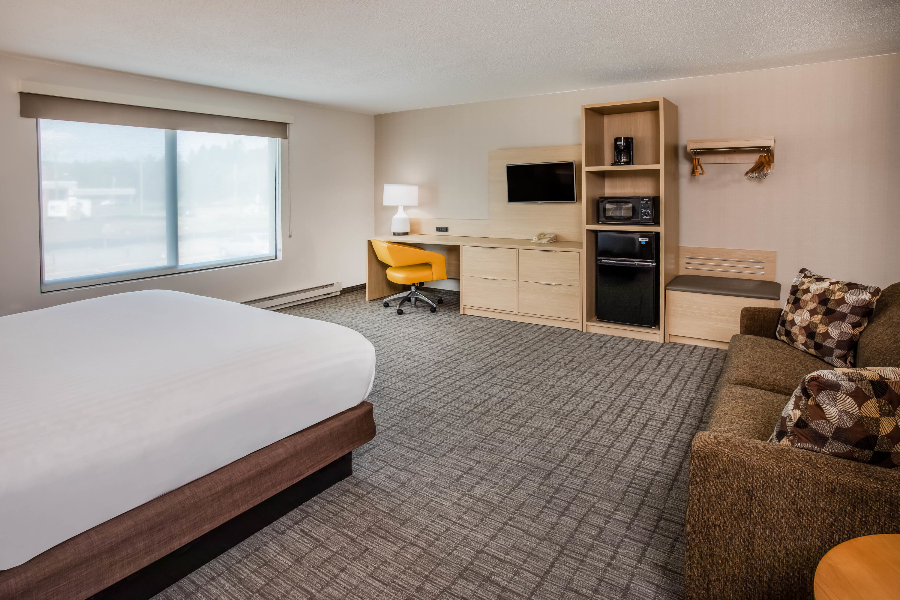 Guest room at the Days Inn & Suites by Wyndham Duluth by the Mall in Duluth, Minnesota