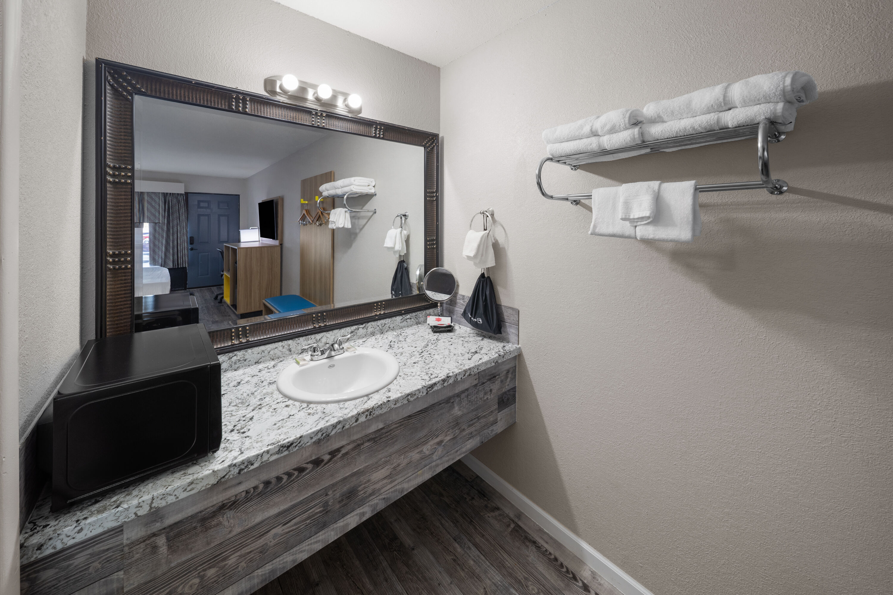 Guest room bath at the Days Inn by Wyndham Branson Ozarks in Branson, Missouri