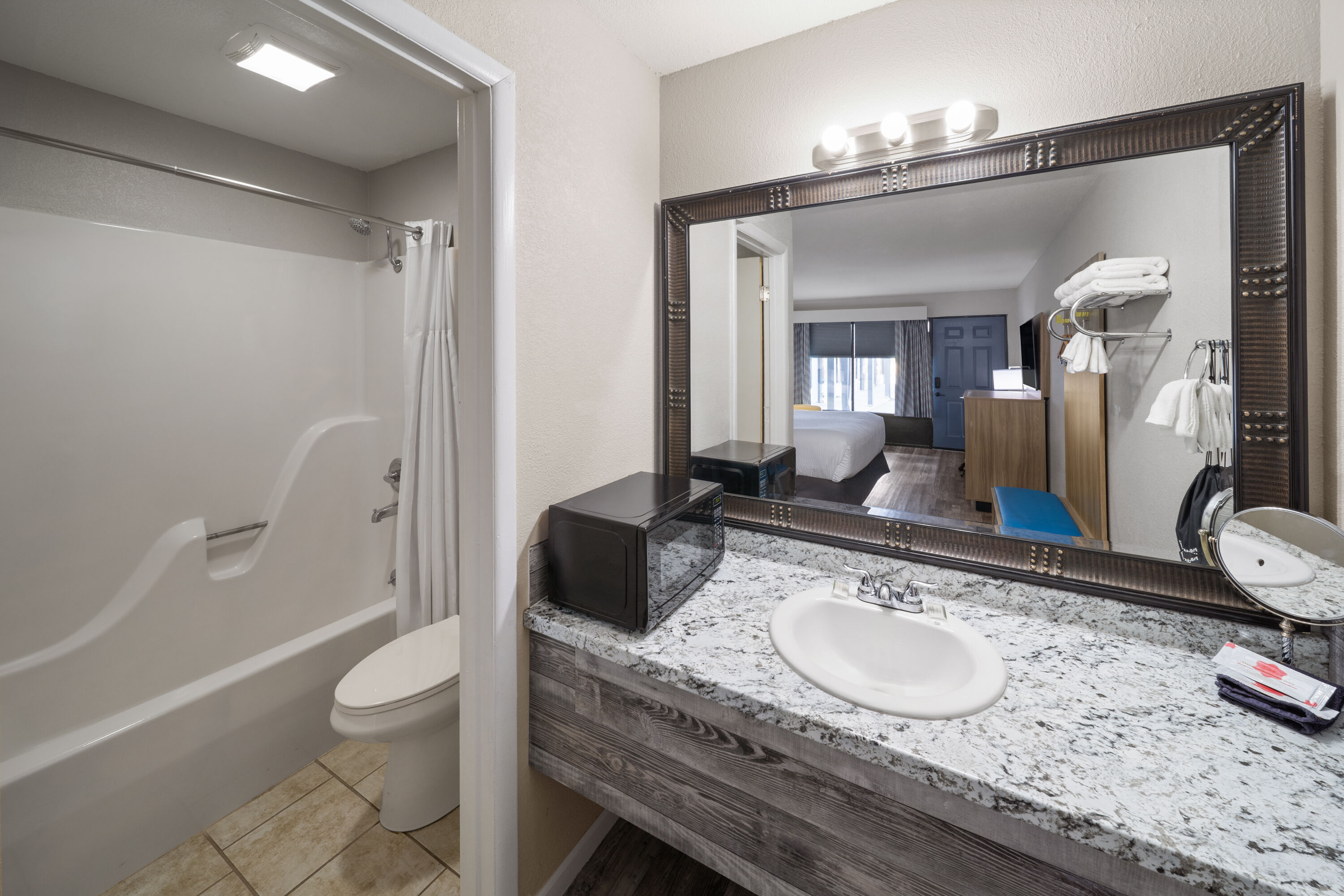 Guest room bath at the Days Inn by Wyndham Branson Ozarks in Branson, Missouri