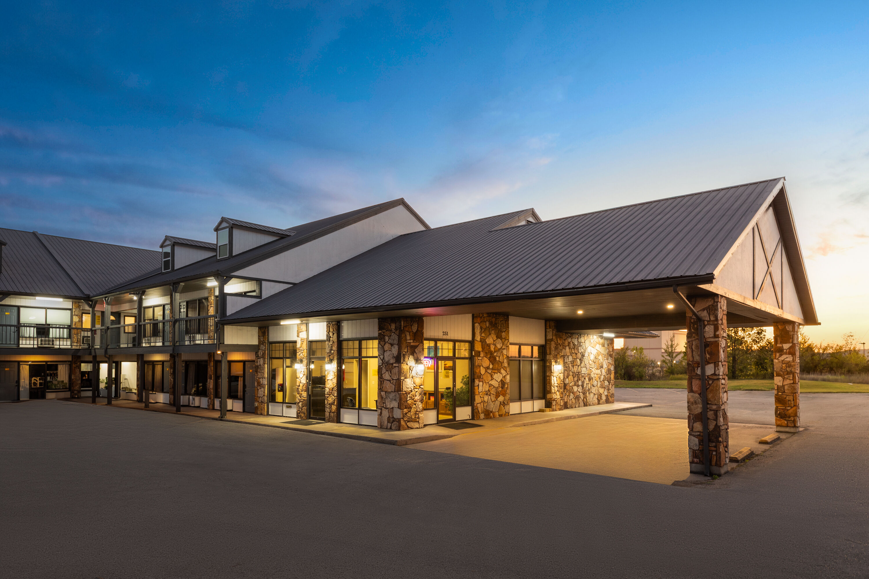 Exterior Dusk Image of Days Inn by Wyndham Branson Ozarks hotel in Branson, Missouri