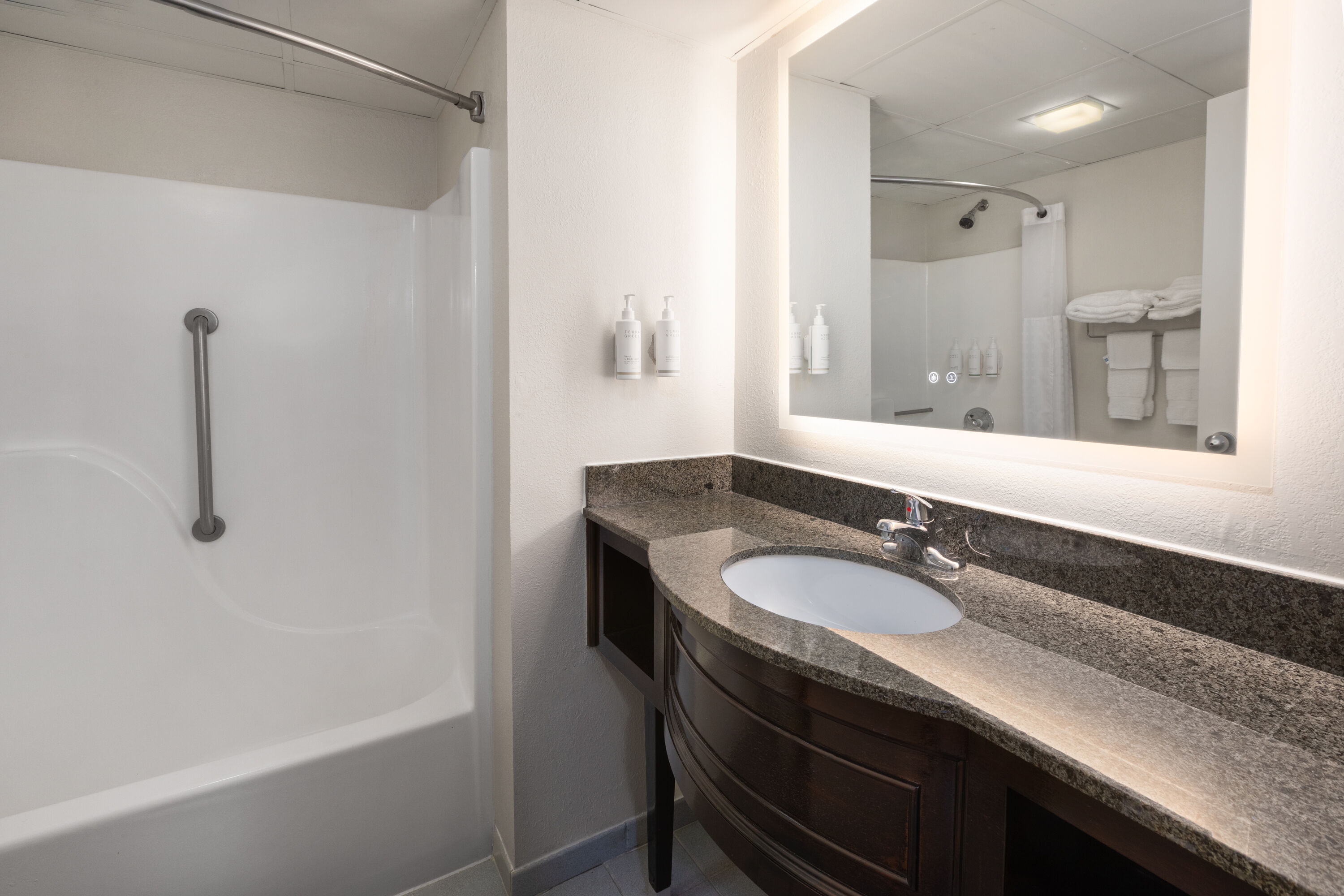 Guest room bath at the Days Inn & Suites by Wyndham Festus in Festus, Missouri