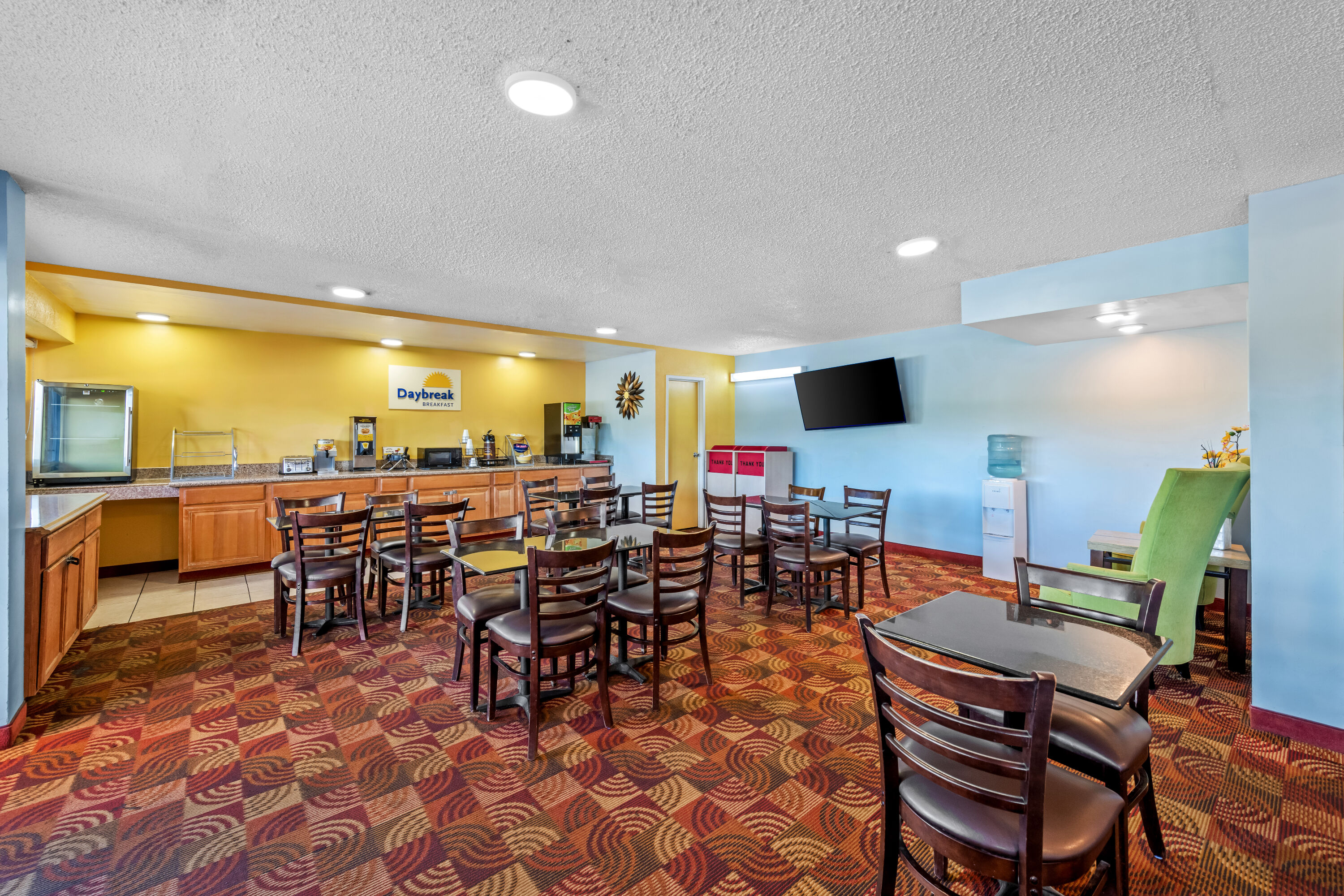 Days Inn by Wyndham Independence restaurant breakfast area with seating in Independence, Missouri