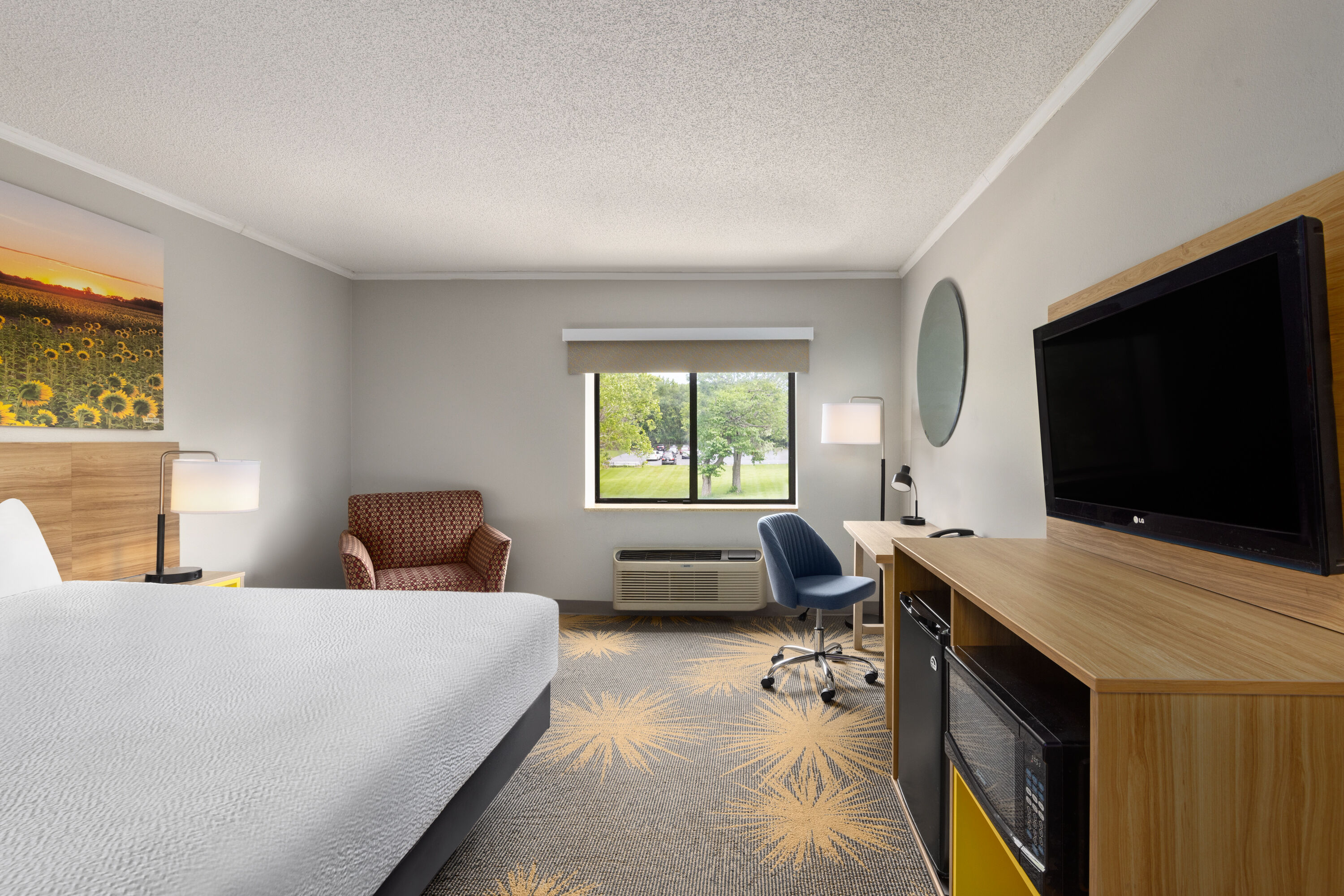 Guest room at the Days Inn & Suites by Wyndham Kansas City South in Kansas City, Missouri