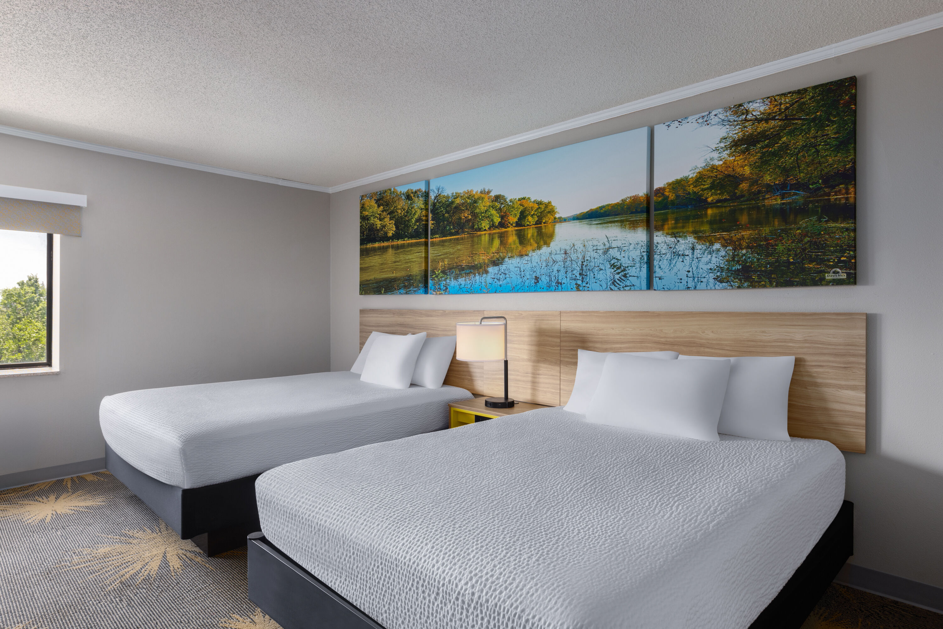 Guest room at the Days Inn & Suites by Wyndham Kansas City South in Kansas City, Missouri