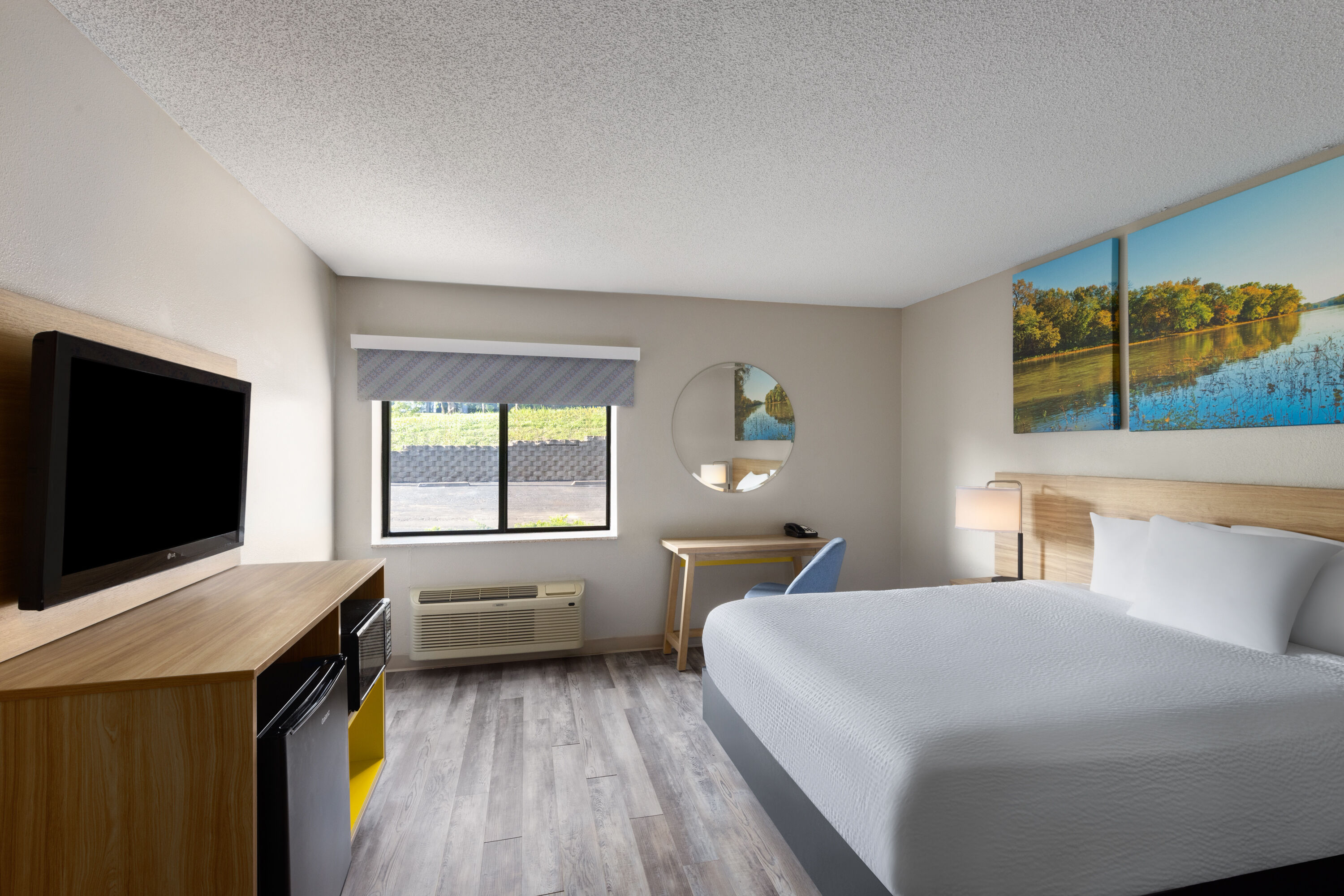 Guest room at the Days Inn & Suites by Wyndham Kansas City South in Kansas City, Missouri