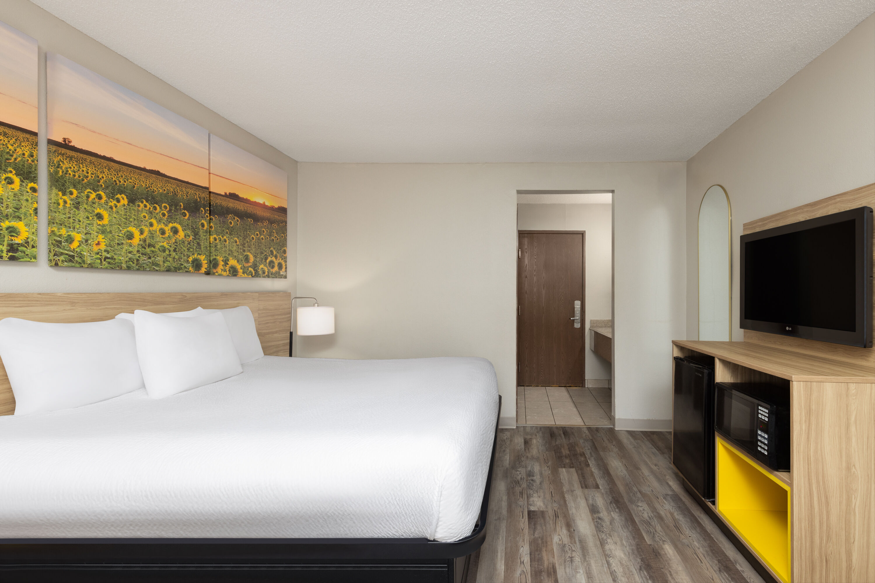 Guest room at the Days Inn & Suites by Wyndham Kansas City South in Kansas City, Missouri