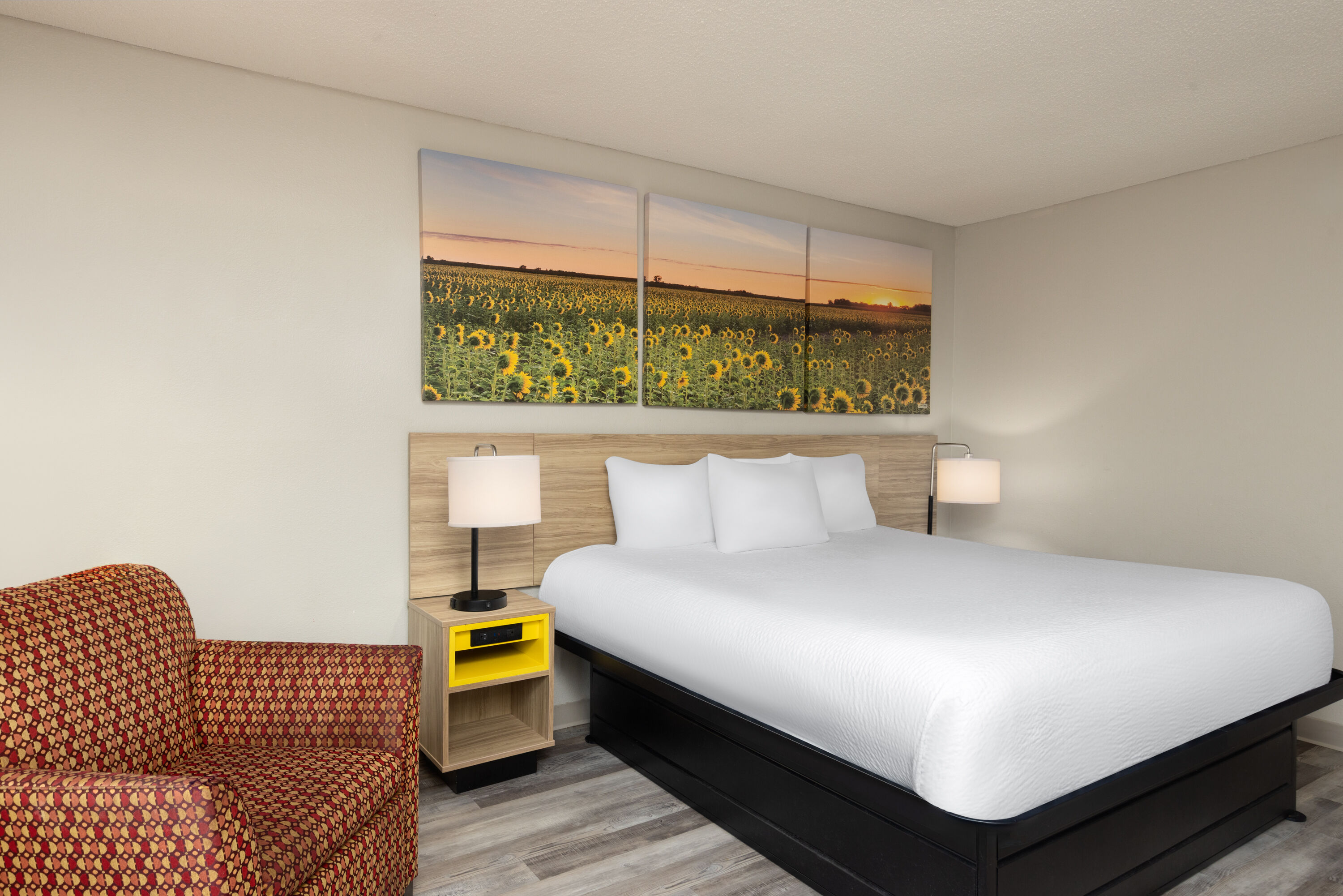 Guest room at the Days Inn & Suites by Wyndham Kansas City South in Kansas City, Missouri