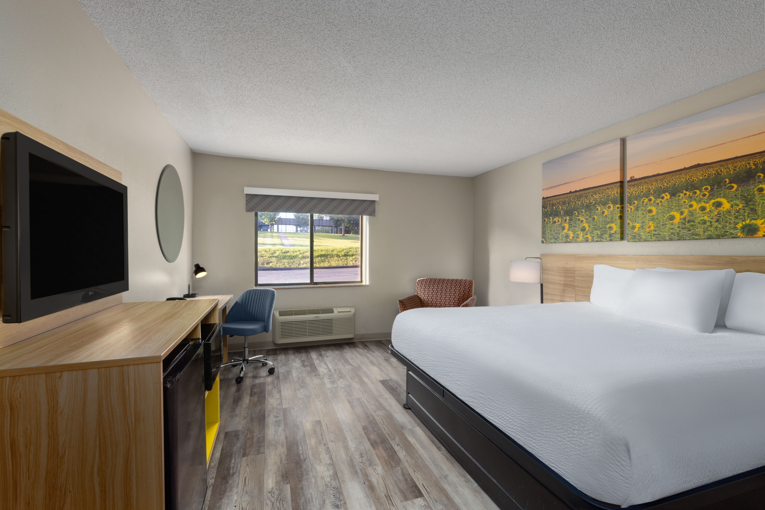 Guest room at the Days Inn & Suites by Wyndham Kansas City South in Kansas City, Missouri