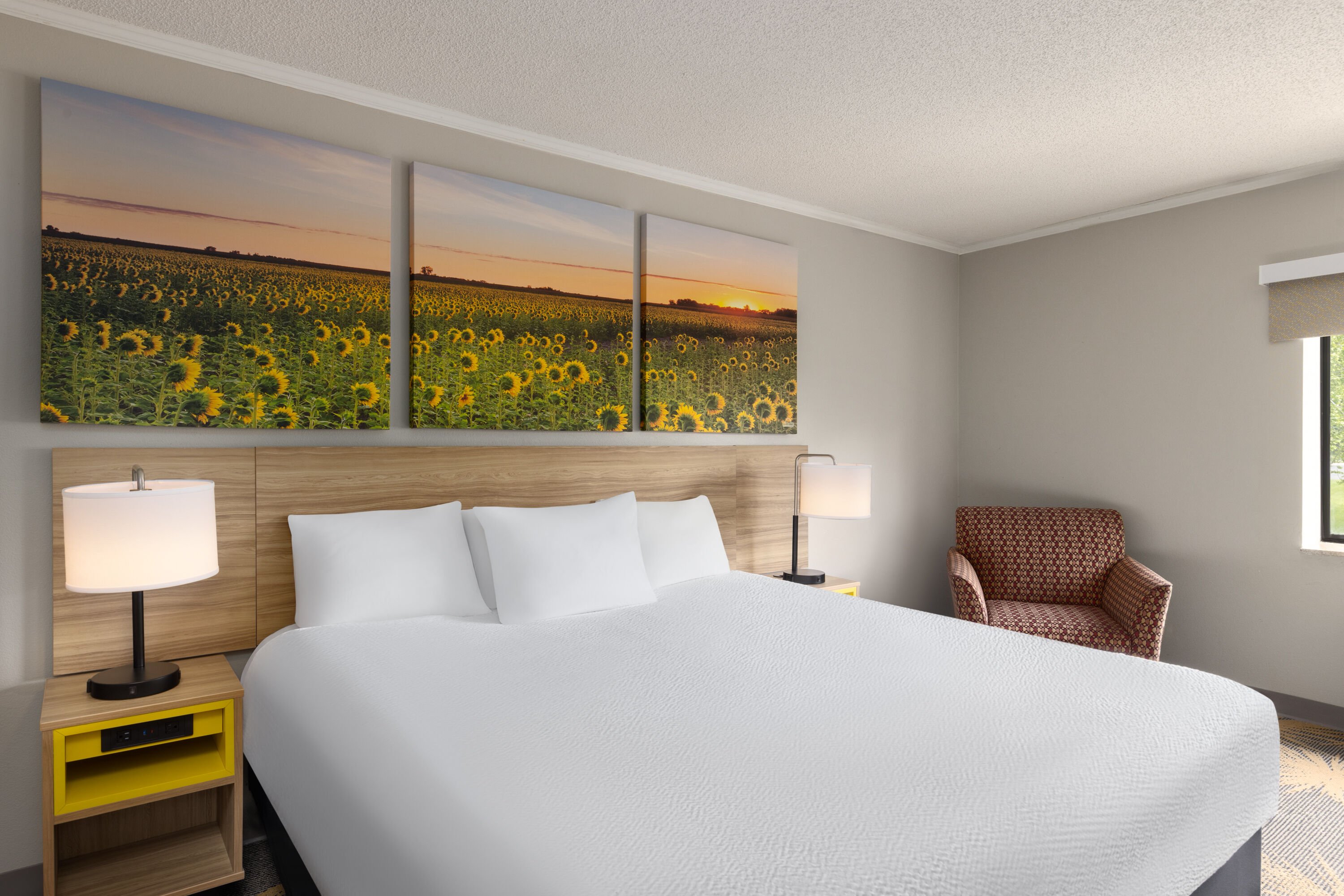 Guest room at the Days Inn & Suites by Wyndham Kansas City South in Kansas City, Missouri