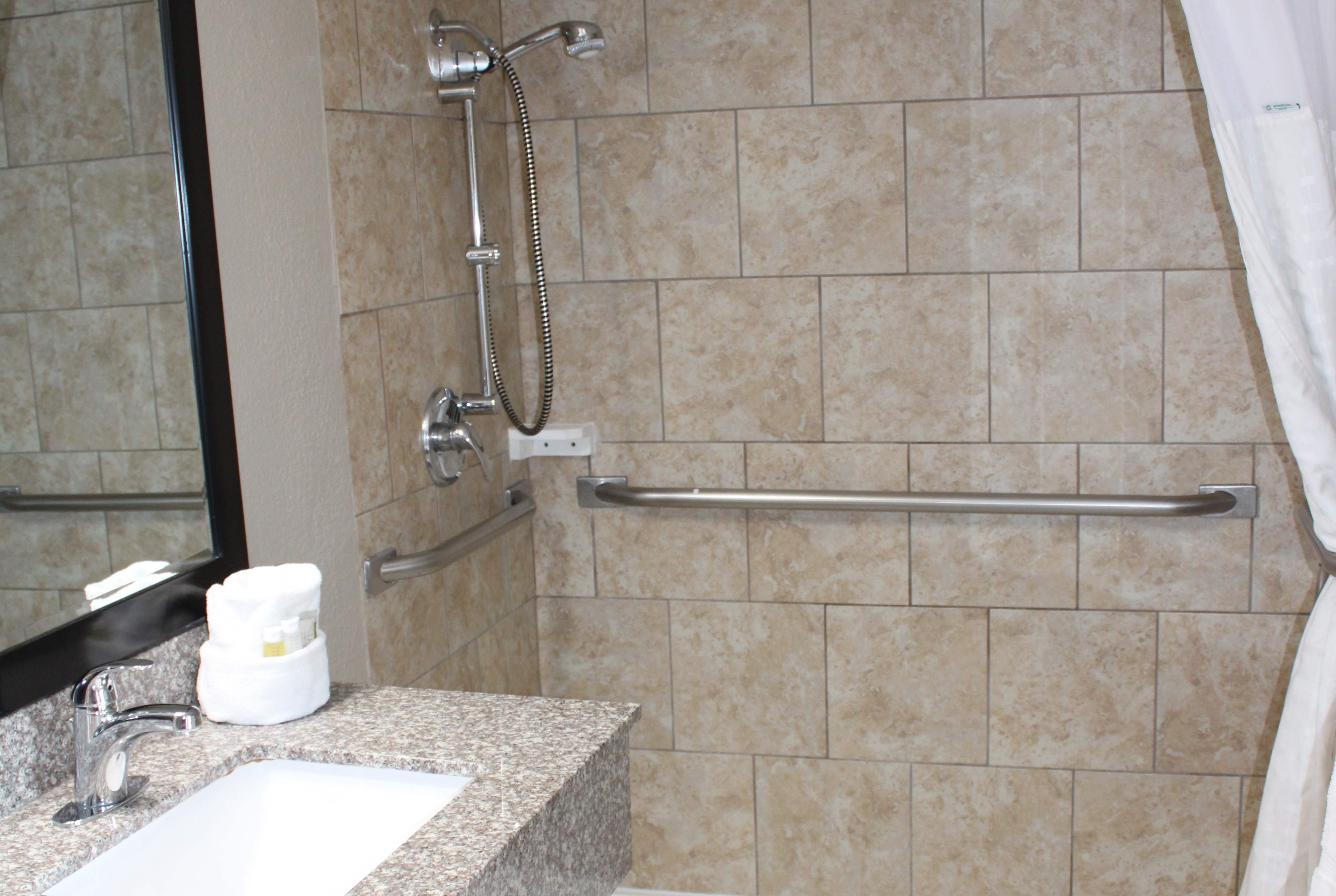 Guest room bath at the Days Inn & Suites by Wyndham Springfield on I-44 in Springfield, Missouri