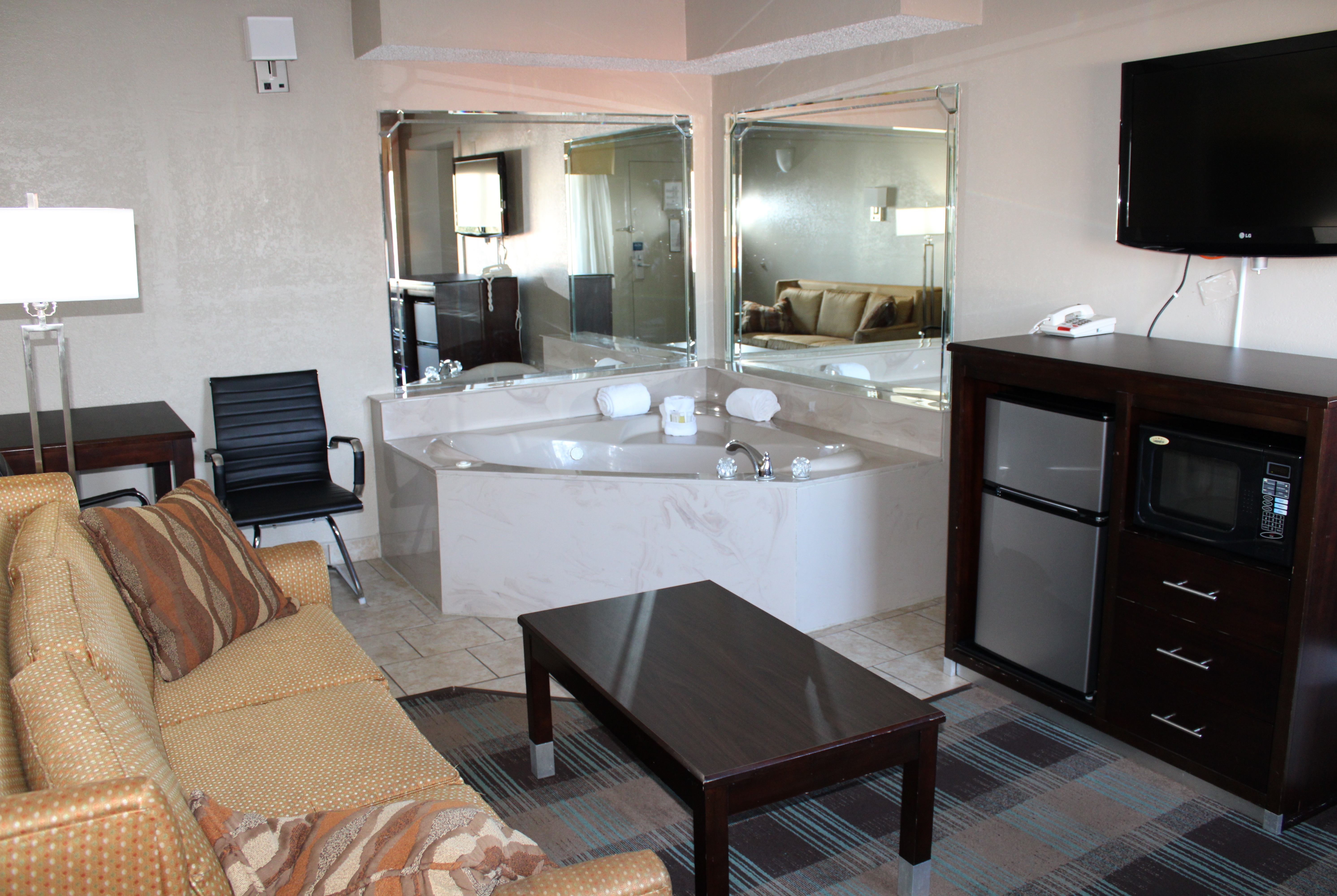 Guest room at the Days Inn & Suites by Wyndham Springfield on I-44 in Springfield, Missouri