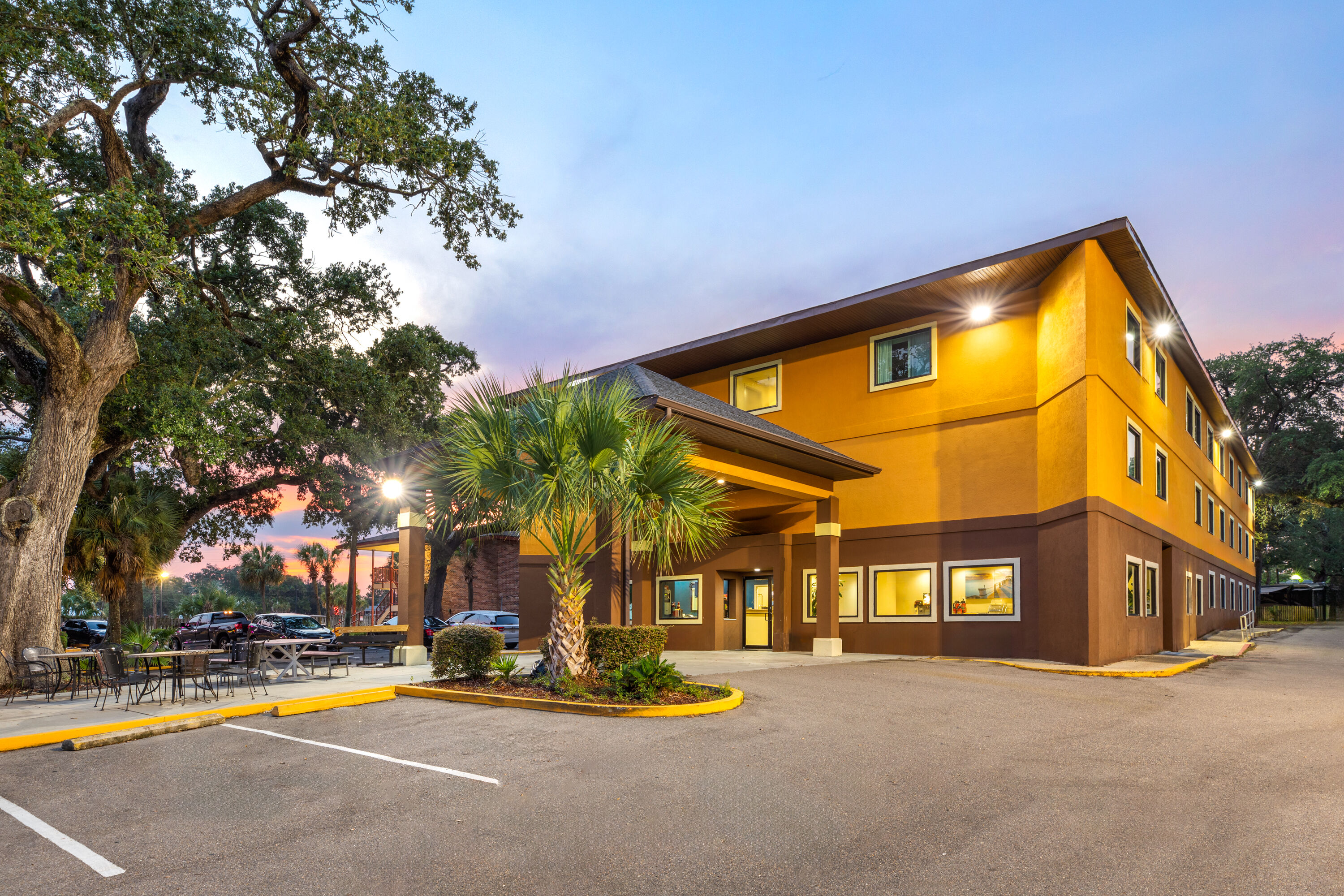 Exterior Dusk Image of Days Inn by Wyndham Biloxi Beach hotel in Biloxi, Mississippi