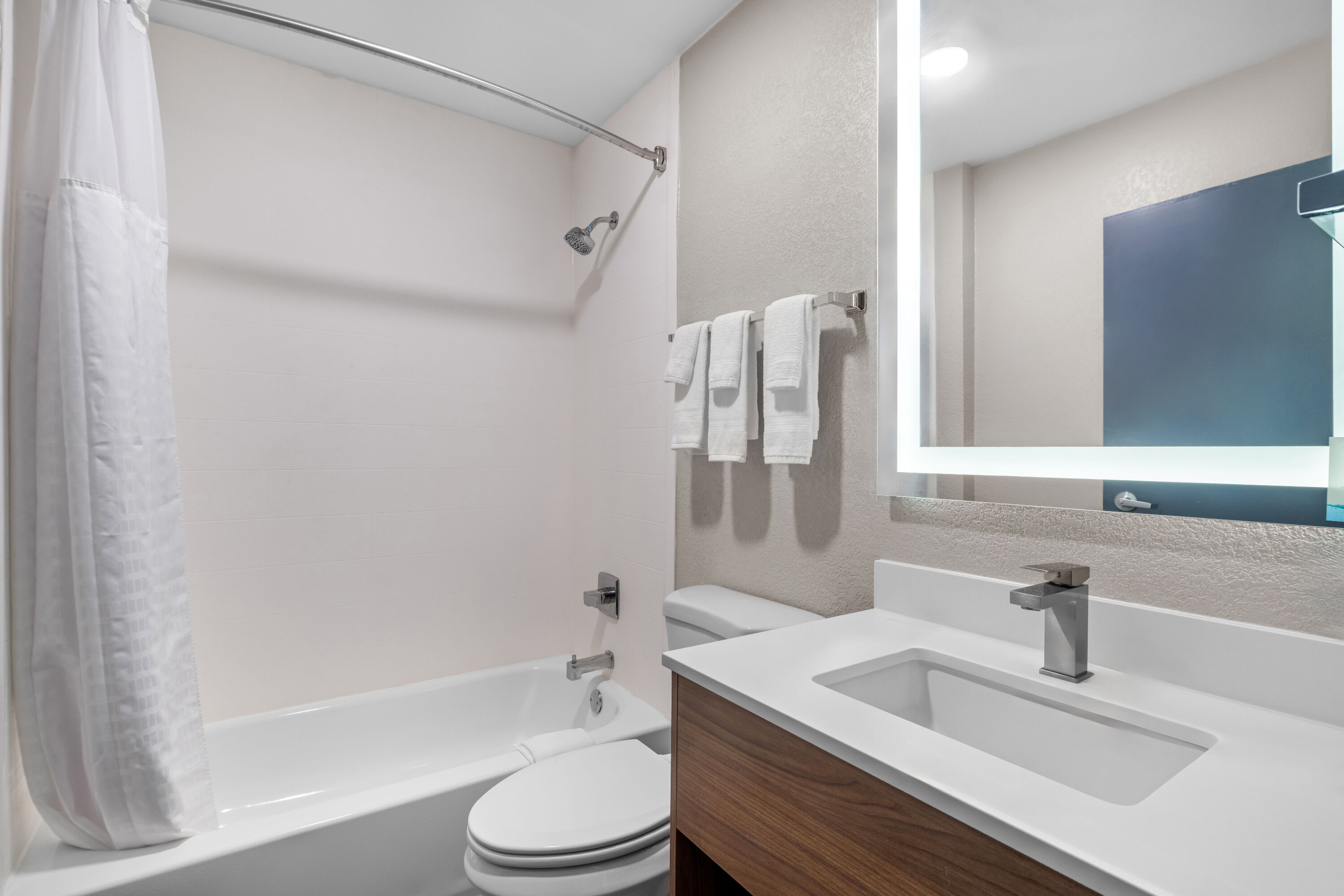 Guest room bath at the Days Inn & Suites by Wyndham Brandon Amphitheater in Brandon, Mississippi