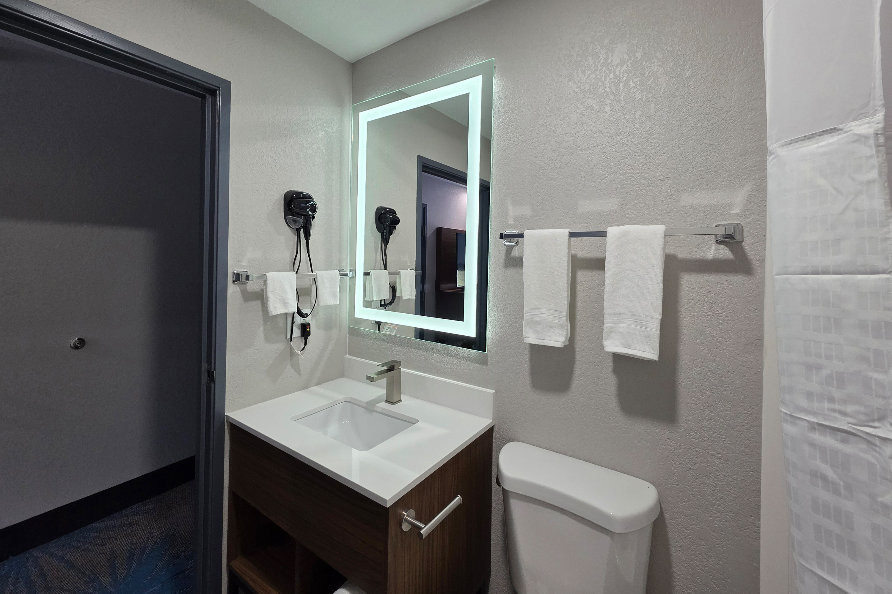 Guest room bath at the Days Inn & Suites by Wyndham Brandon Amphitheater in Brandon, Mississippi