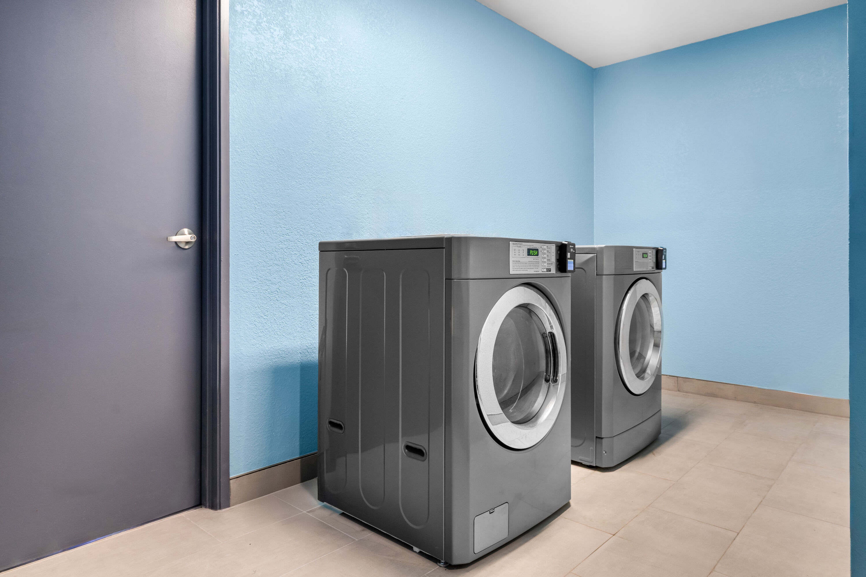 Laundry facilities at Days Inn & Suites by Wyndham Brandon Amphitheater in Brandon, Mississippi