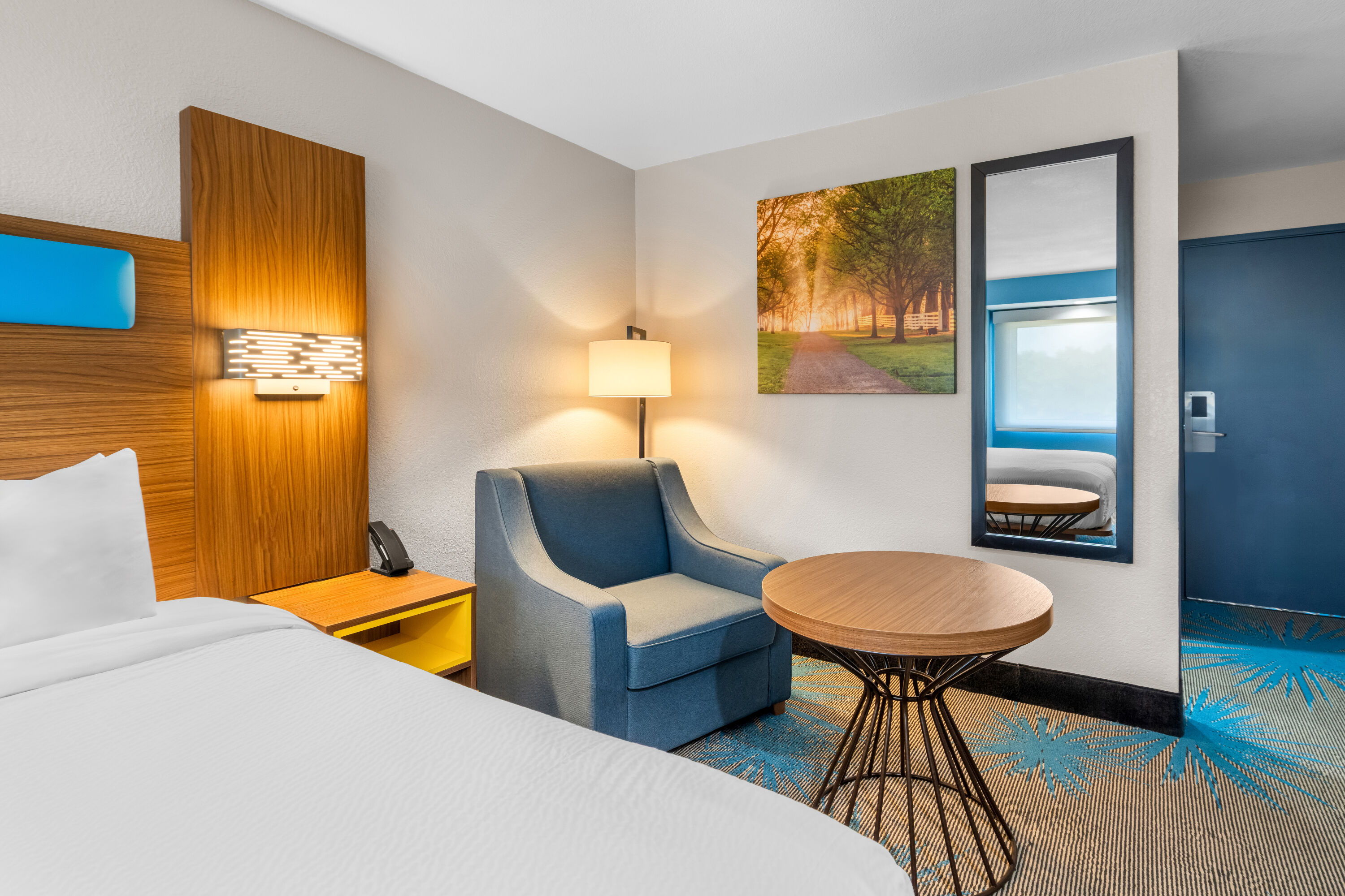 King bed guest room at the Days Inn & Suites by Wyndham Brandon Amphitheater in Brandon, Mississippi