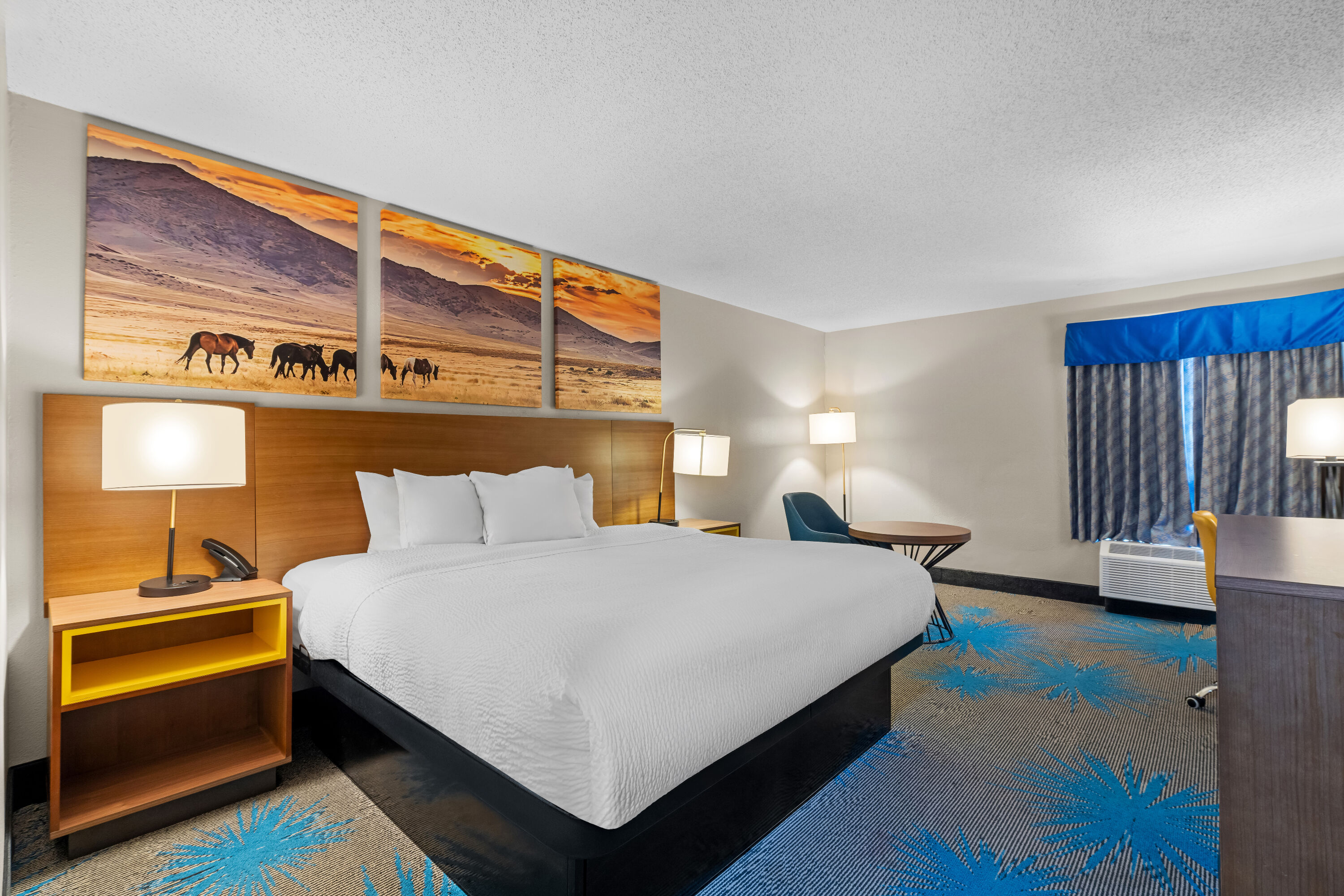 King bed guest room at the Days Inn & Suites by Wyndham Ridgeland in Ridgeland, Mississippi