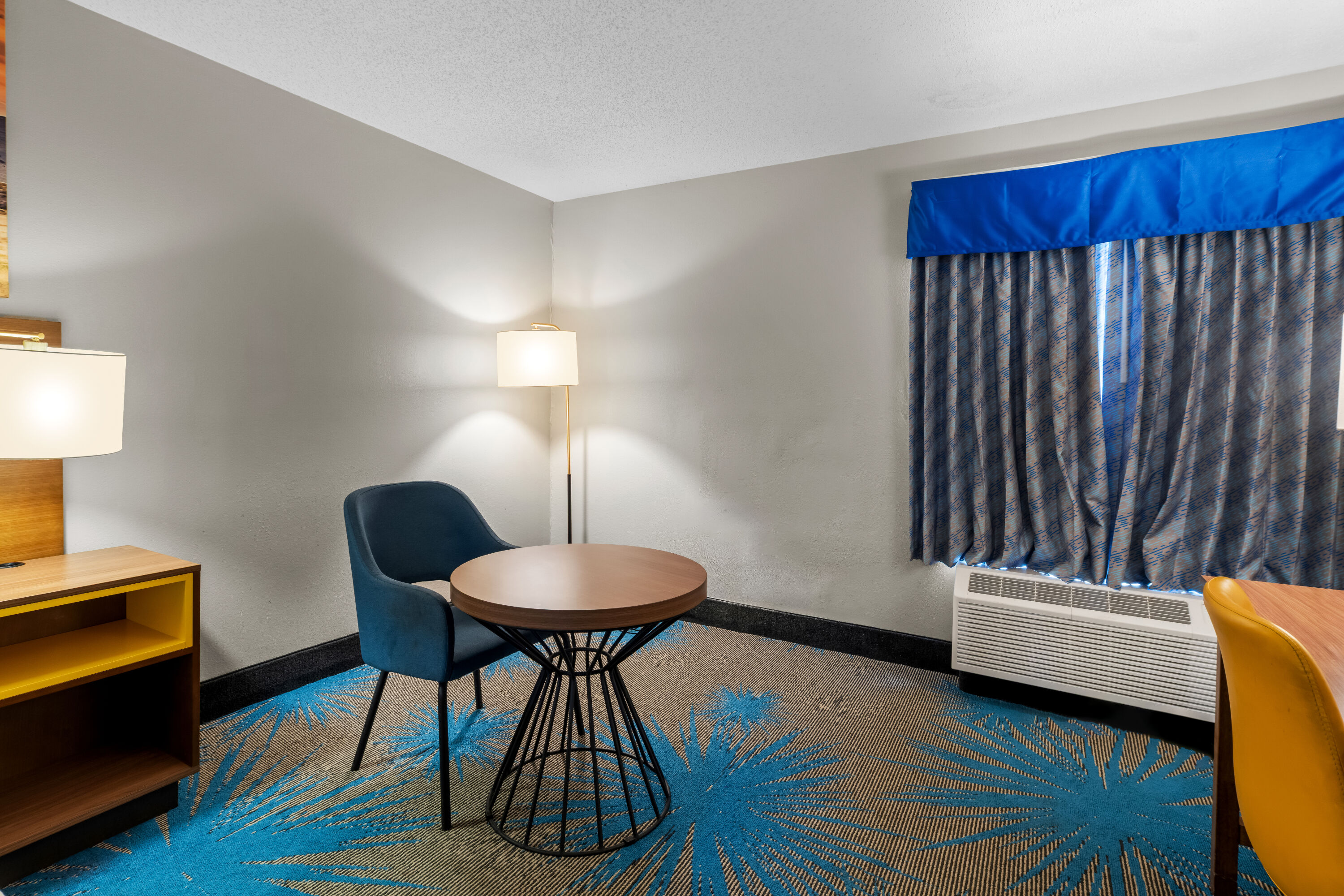 King bed guest room at the Days Inn & Suites by Wyndham Ridgeland in Ridgeland, Mississippi