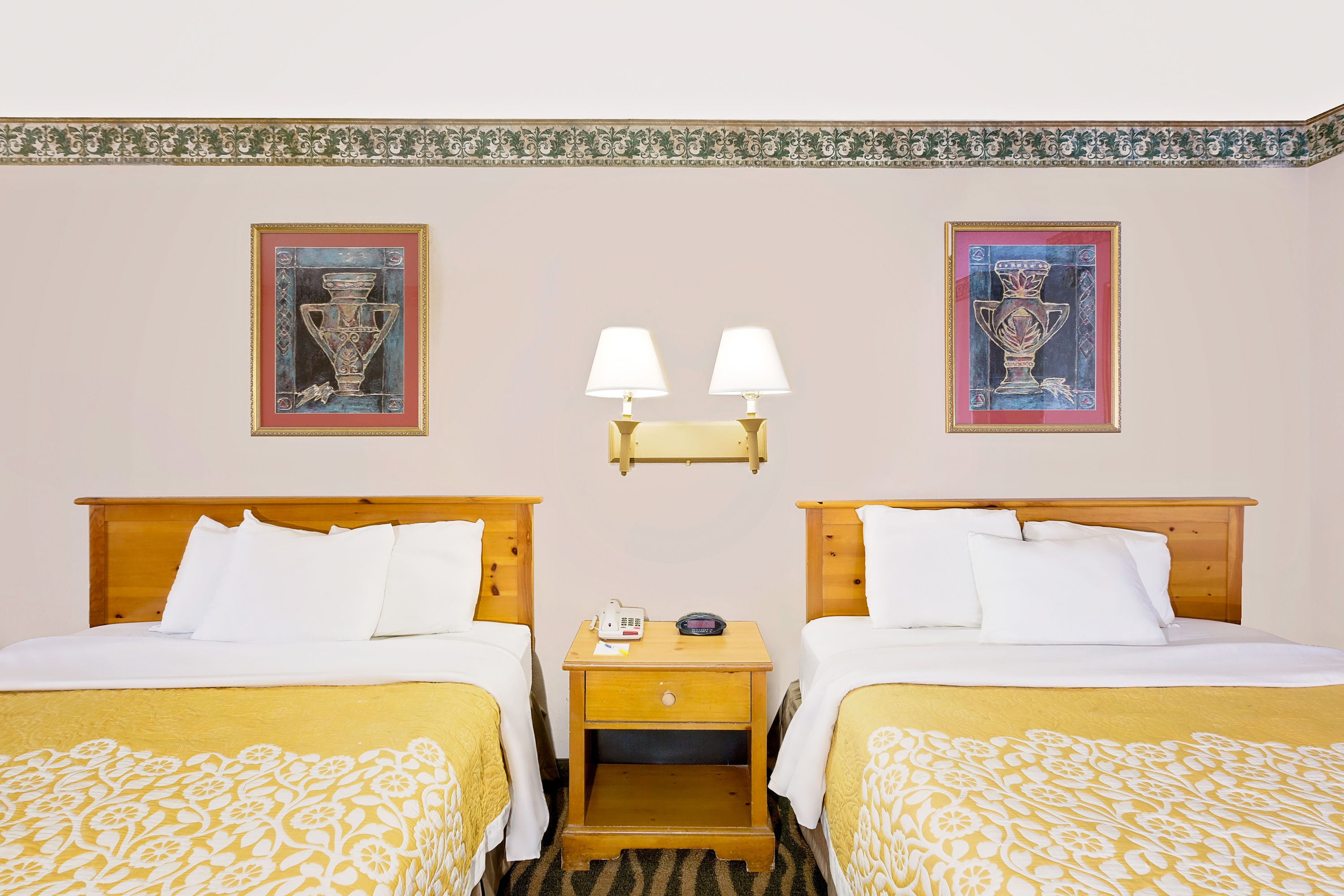 Guest room at the Days Inn & Suites by Wyndham Starkville in Starkville, Mississippi