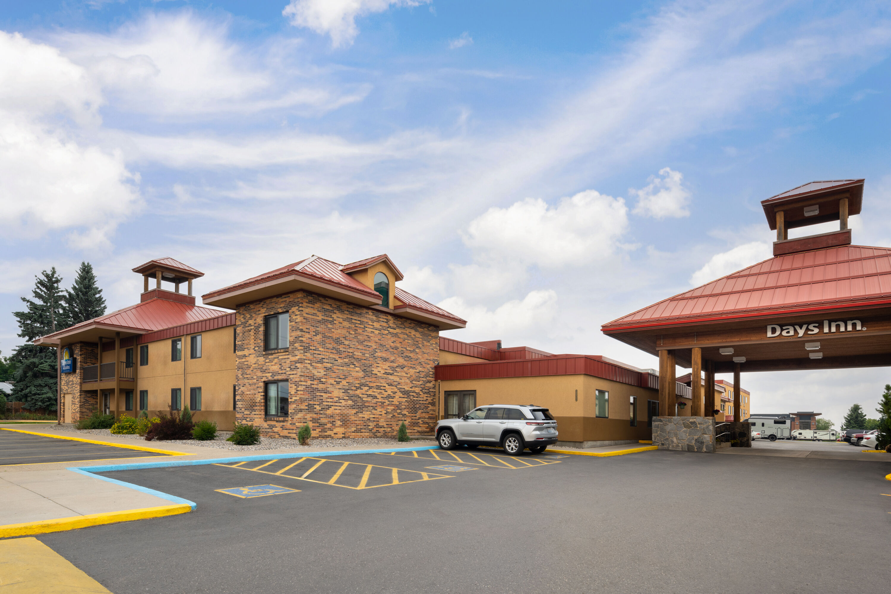 Exterior Day Image of Days Inn & Suites by Wyndham Bozeman hotel in Bozeman, Montana