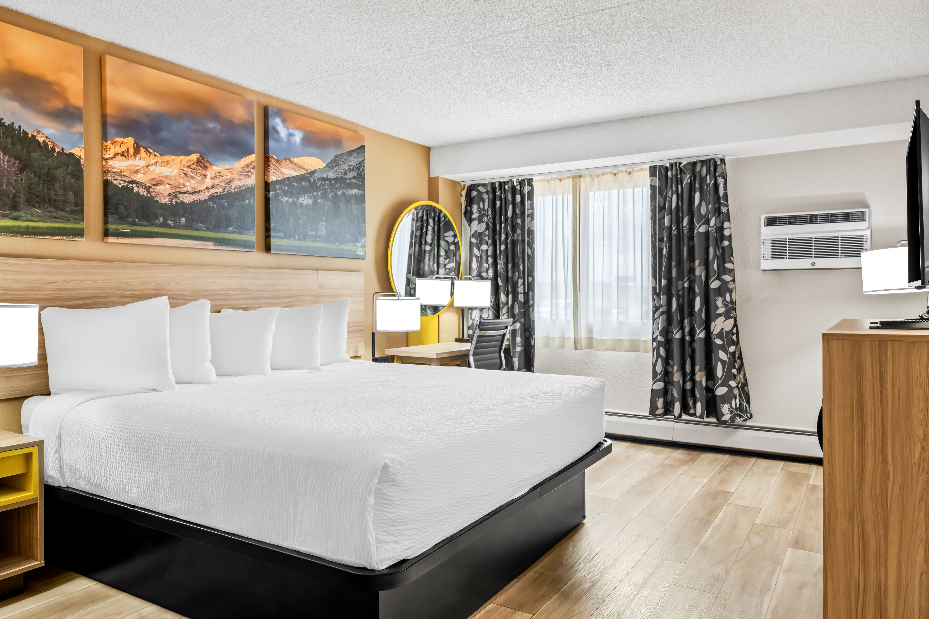 King bed guest room at the Days Inn by Wyndham Helena in Helena, Montana