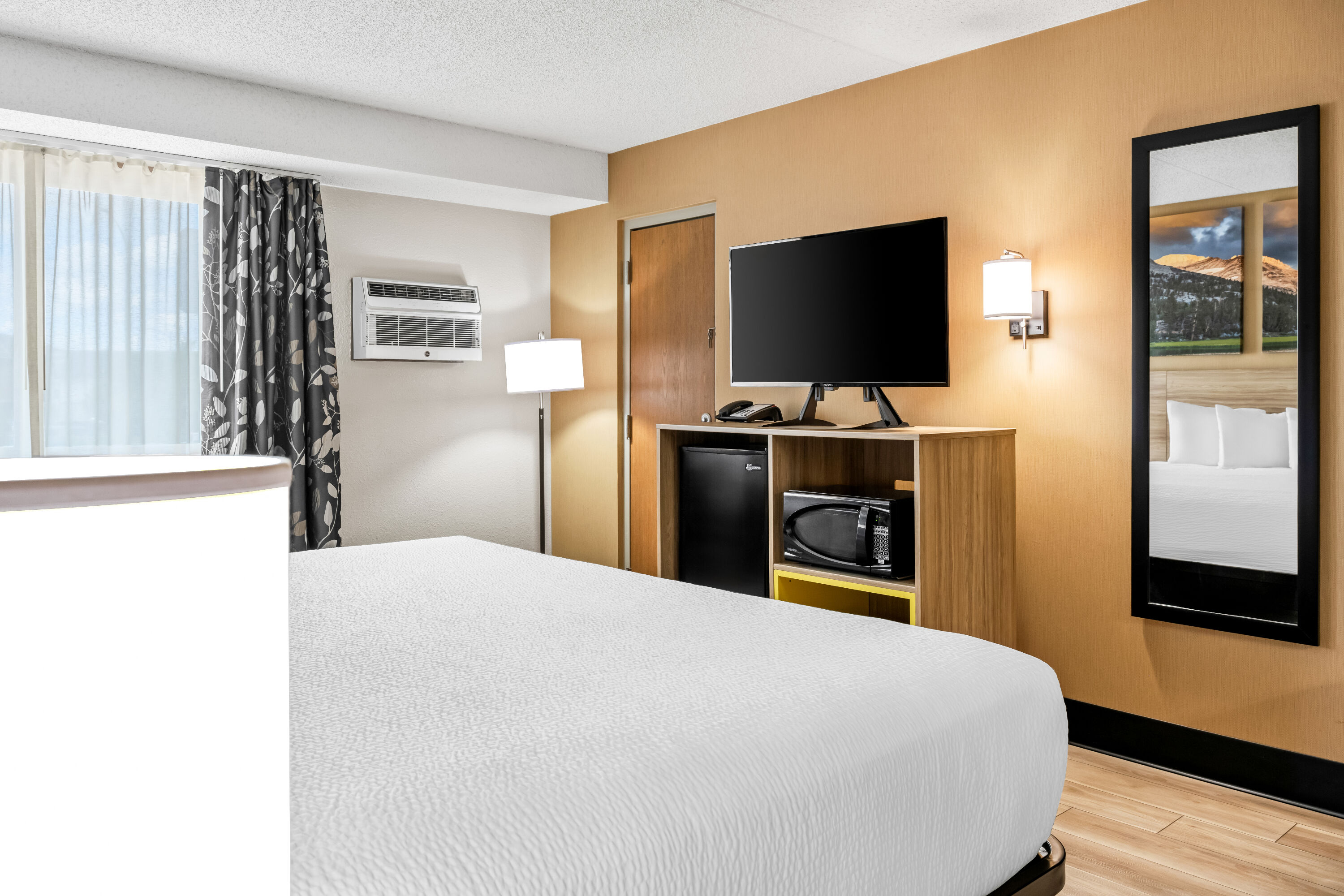 King bed guest room at the Days Inn by Wyndham Helena in Helena, Montana