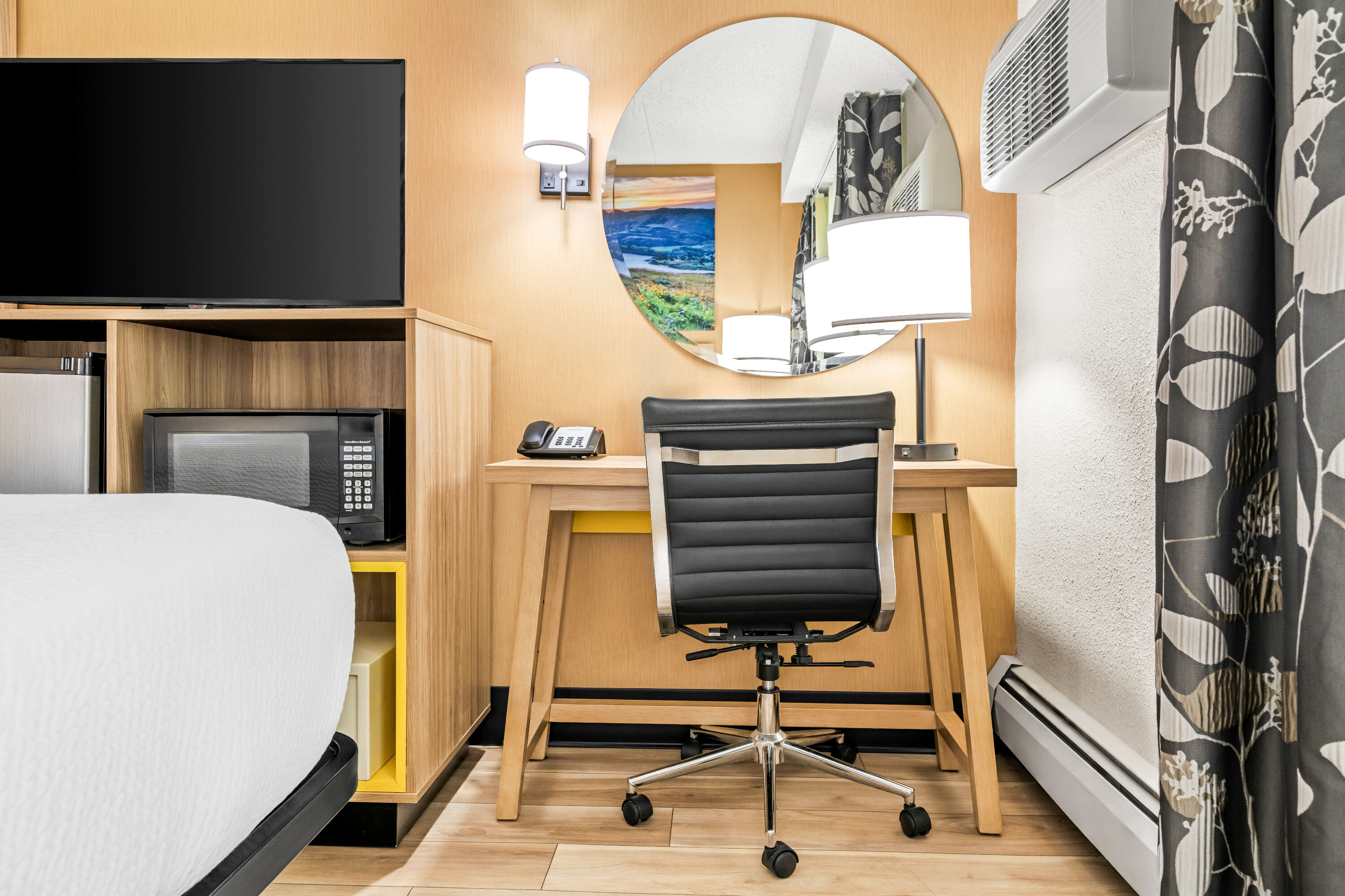 Queen bed guest room at the Days Inn by Wyndham Helena in Helena, Montana
