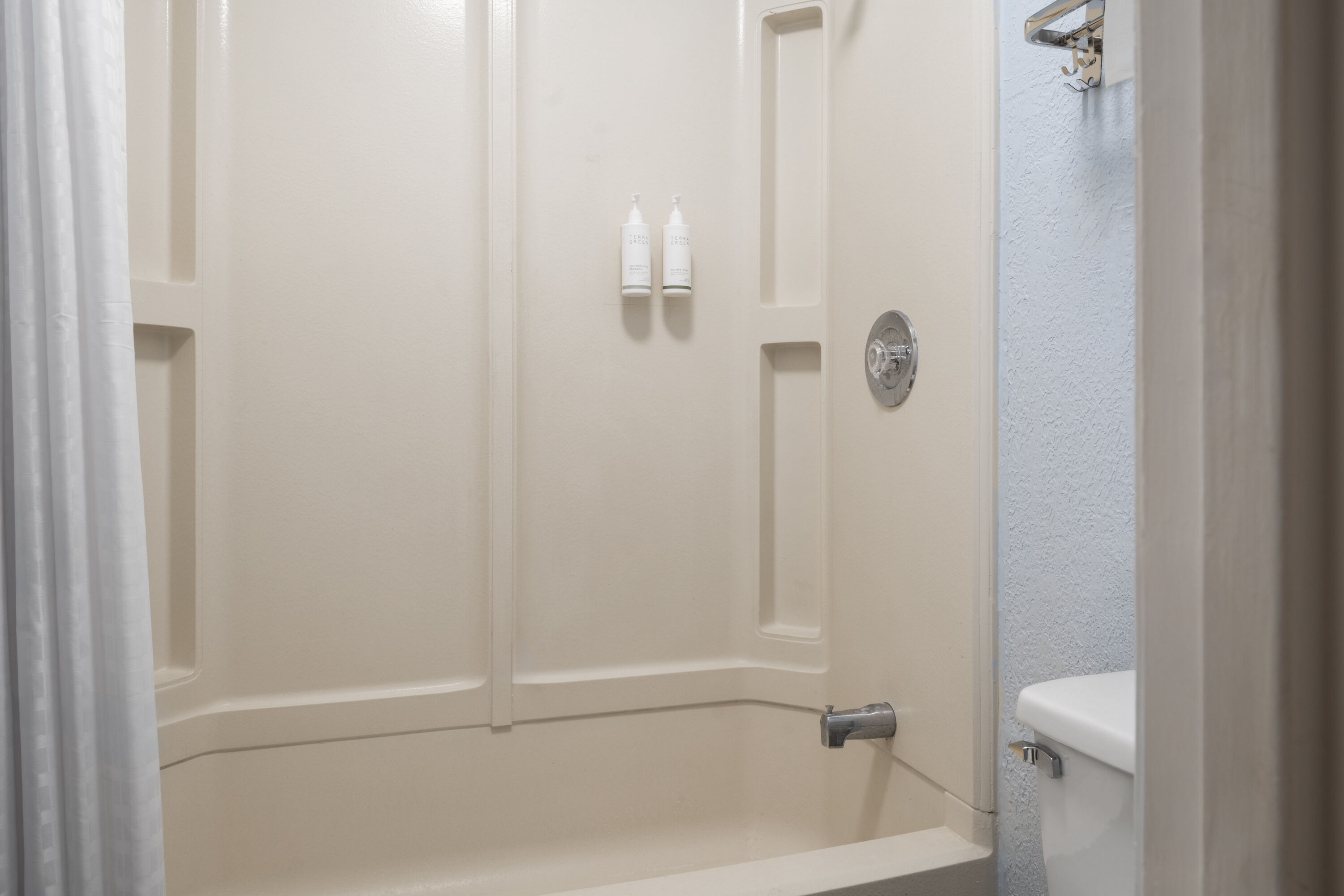 Guest room bath at the Days Inn by Wyndham Charlotte University in Charlotte, North Carolina
