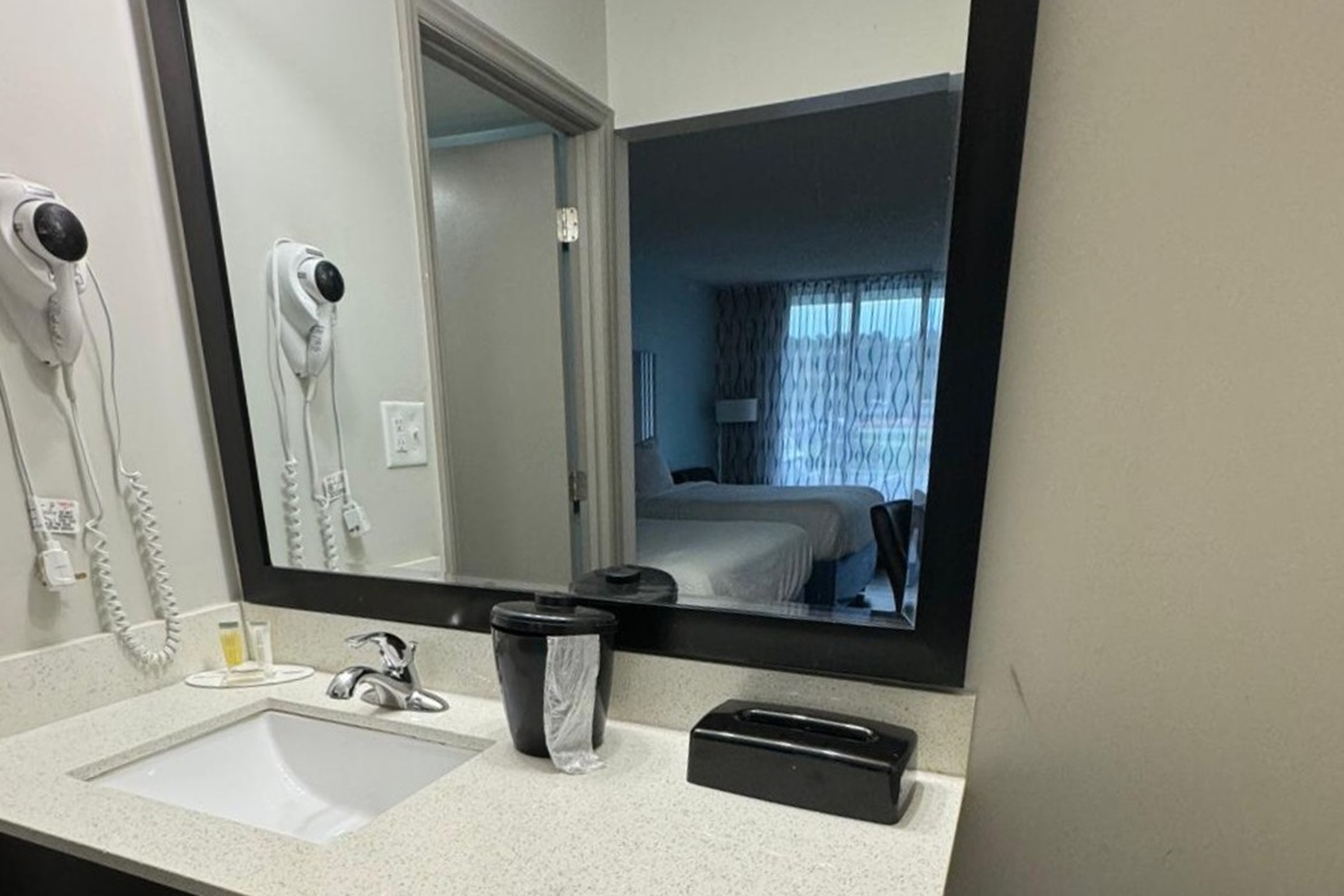 Guest room bath at the Days Inn by Wyndham Goldsboro in Goldsboro, North Carolina