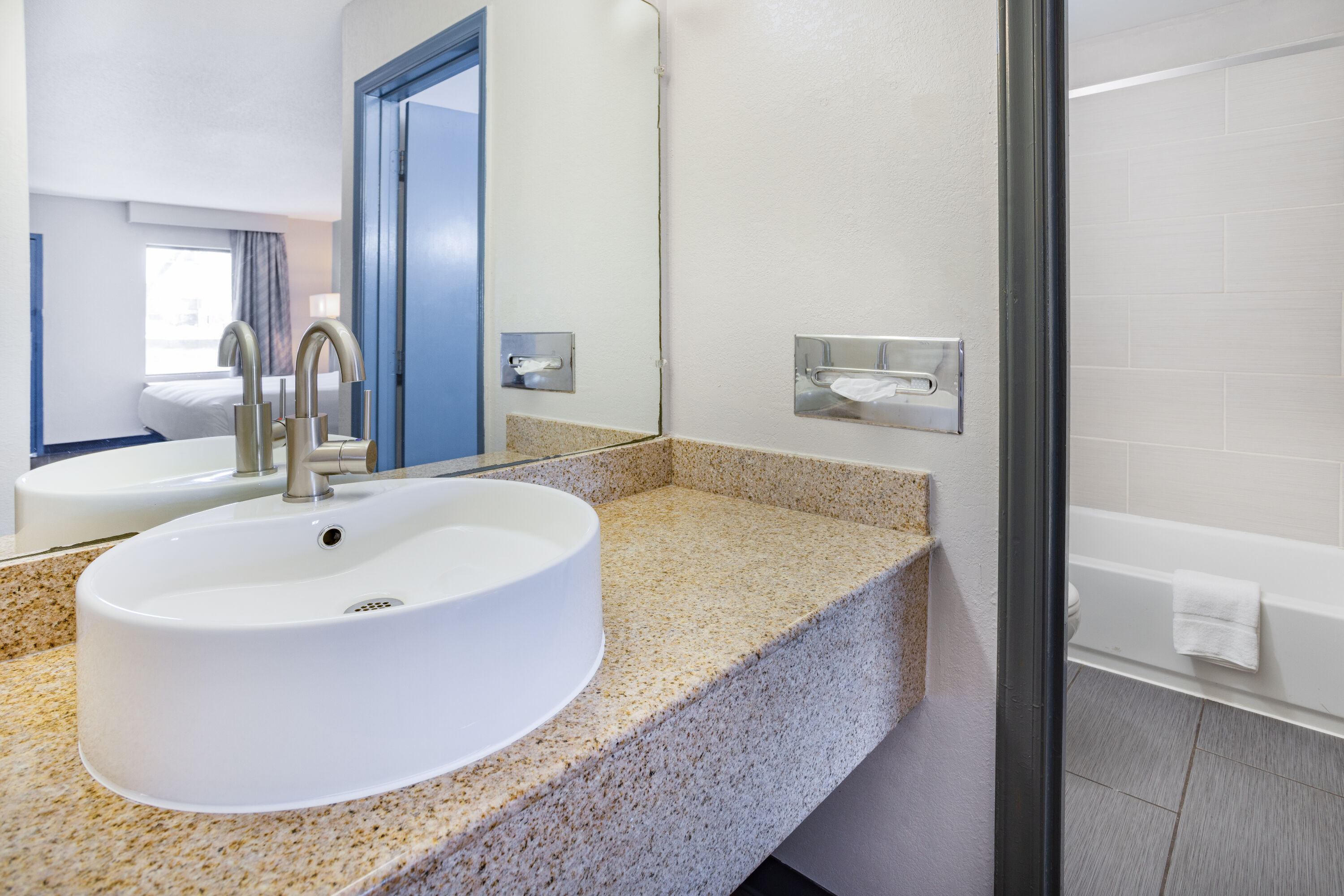 Guest room bath at the Days Inn by Wyndham Raleigh Glenwood-Crabtree in Raleigh, North Carolina