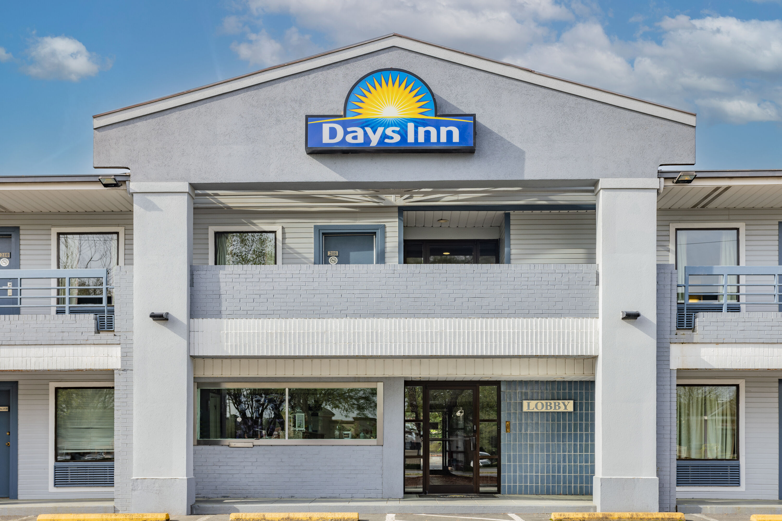 Exterior Day Image of Days Inn by Wyndham Raleigh Glenwood-Crabtree hotel in Raleigh, North Carolina