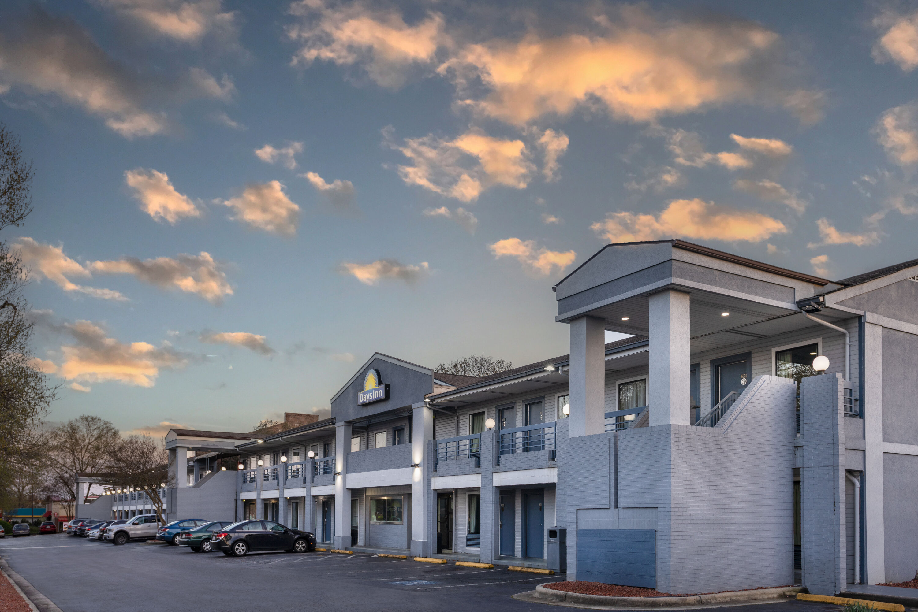 Exterior Dusk Image of Days Inn by Wyndham Raleigh Glenwood-Crabtree hotel in Raleigh, North Carolina