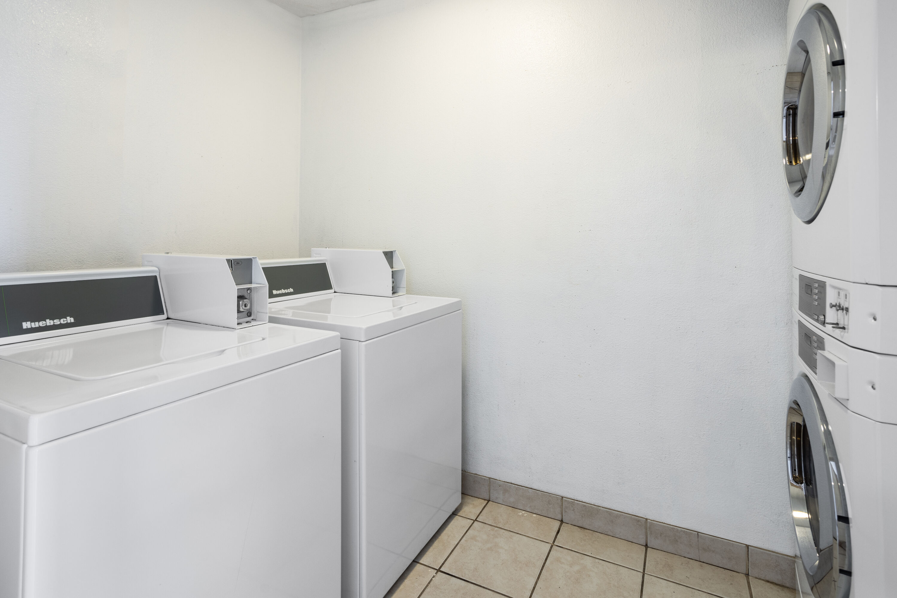 Laundry facilities at Days Inn by Wyndham Raleigh Glenwood-Crabtree in Raleigh, North Carolina