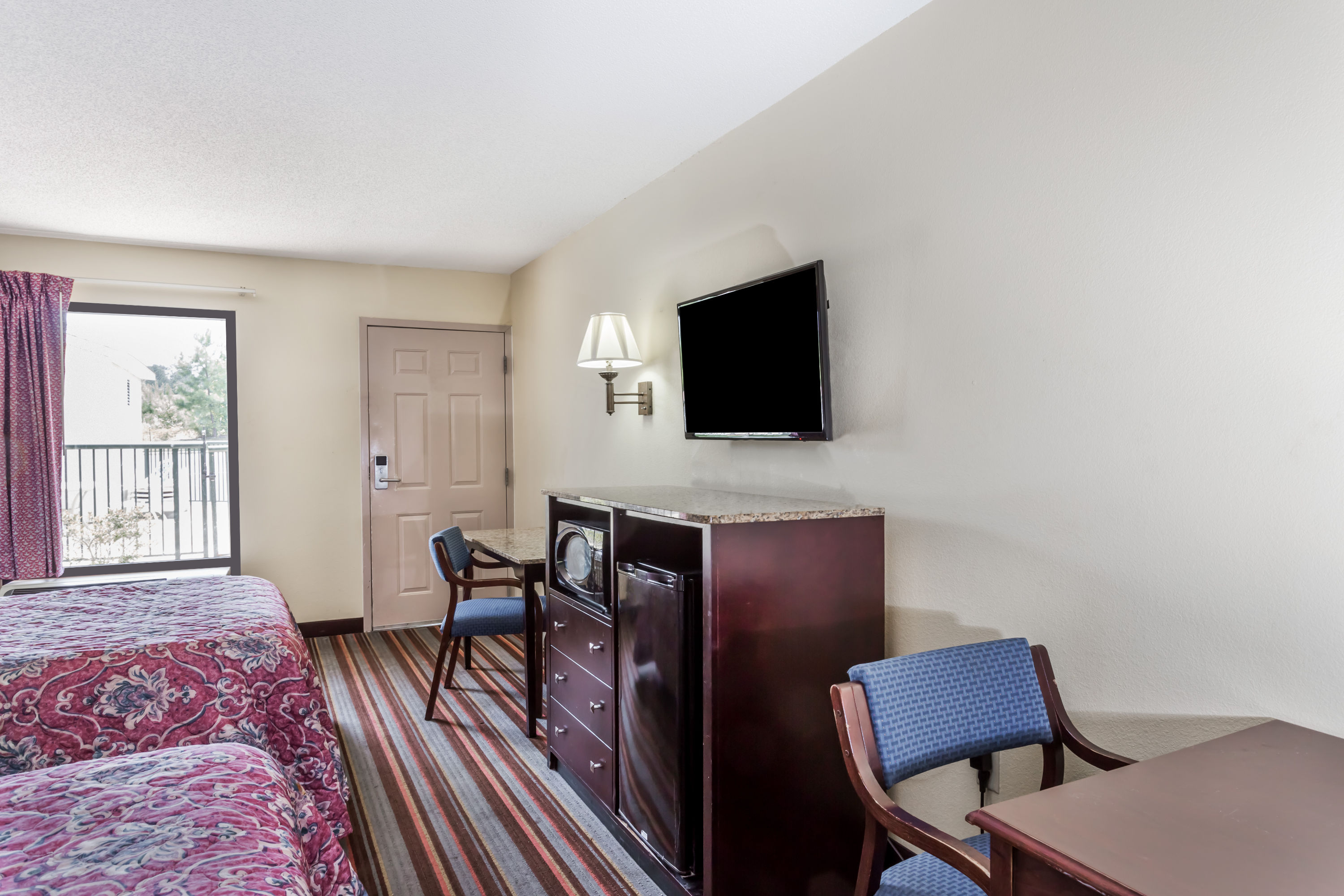 Guest room at the Days Inn by Wyndham Sanford in Sanford, North Carolina