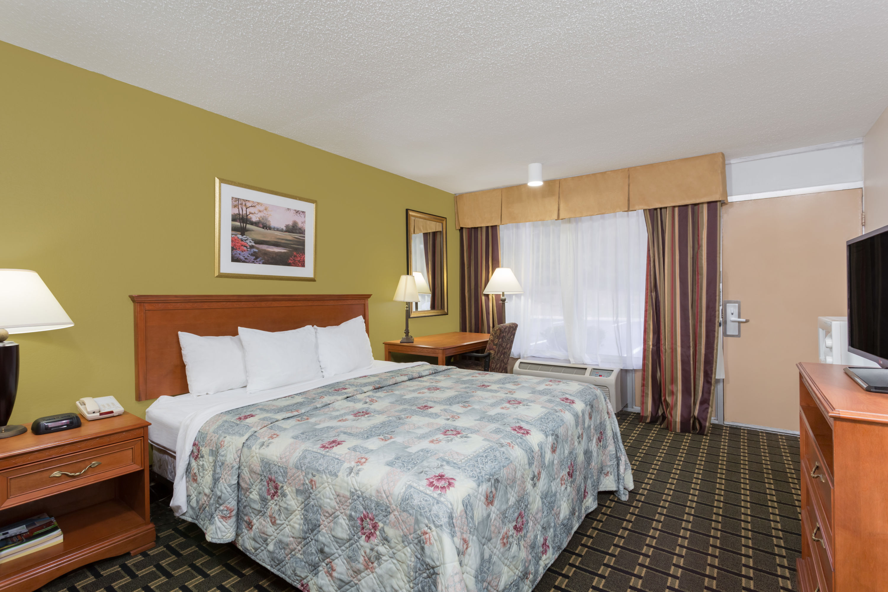 Guest room at the Days Inn & Conf Center by Wyndham Southern Pines Pinehurst in Southern Pines, North Carolina