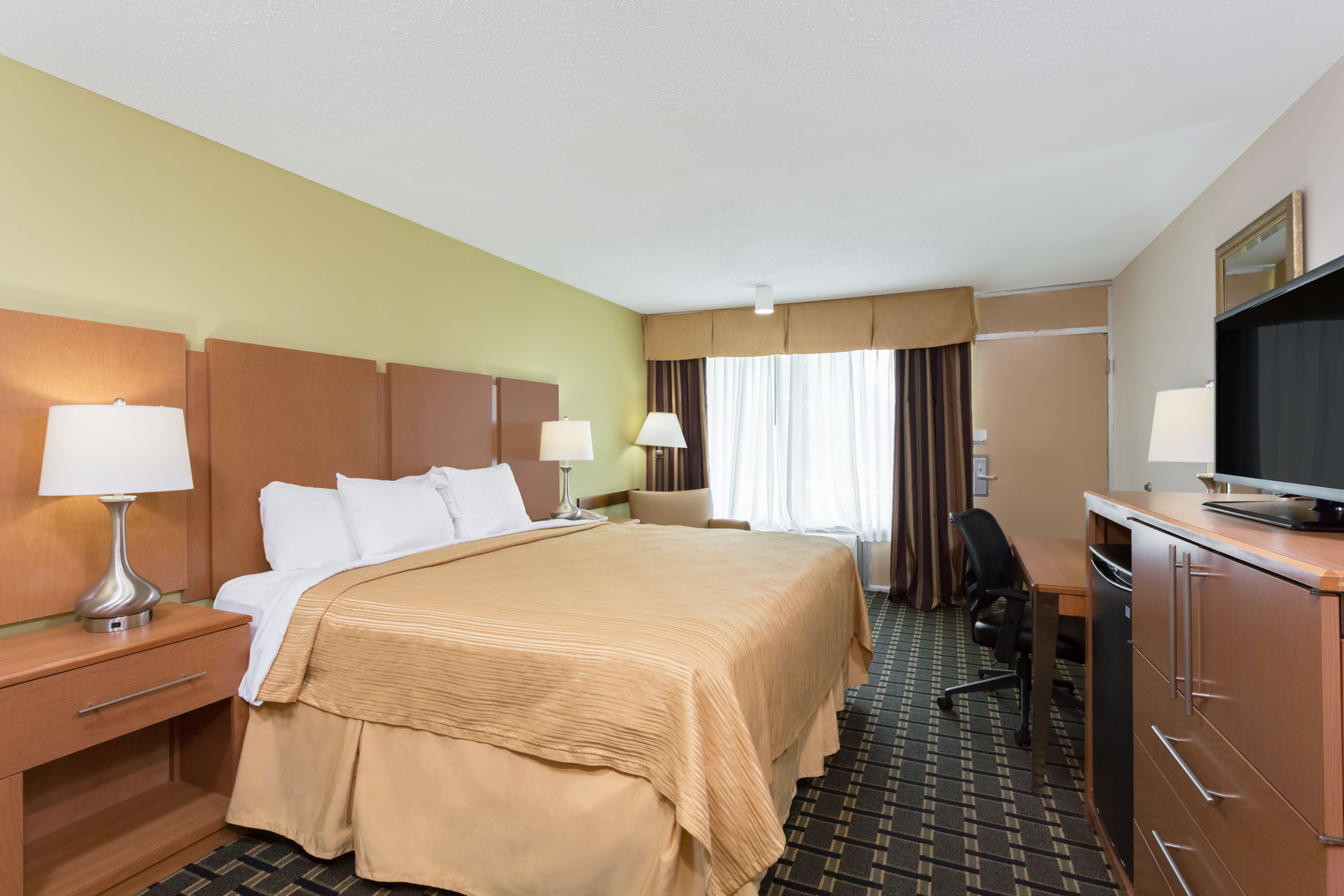 Guest room at the Days Inn & Conf Center by Wyndham Southern Pines Pinehurst in Southern Pines, North Carolina
