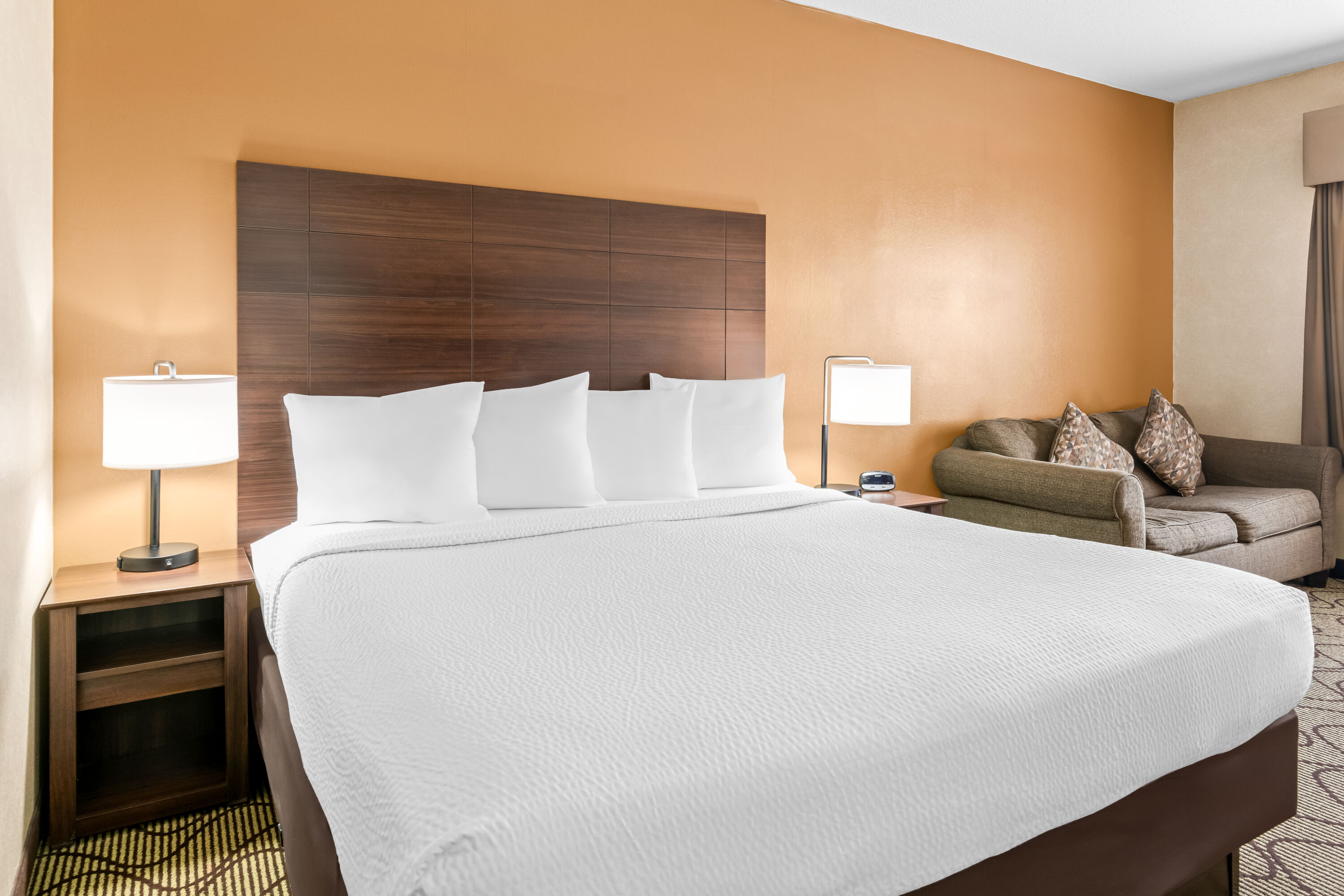 King bed guest room at the Days Inn by Wyndham Grand Forks Columbia Mall in Grand Forks, North Dakota
