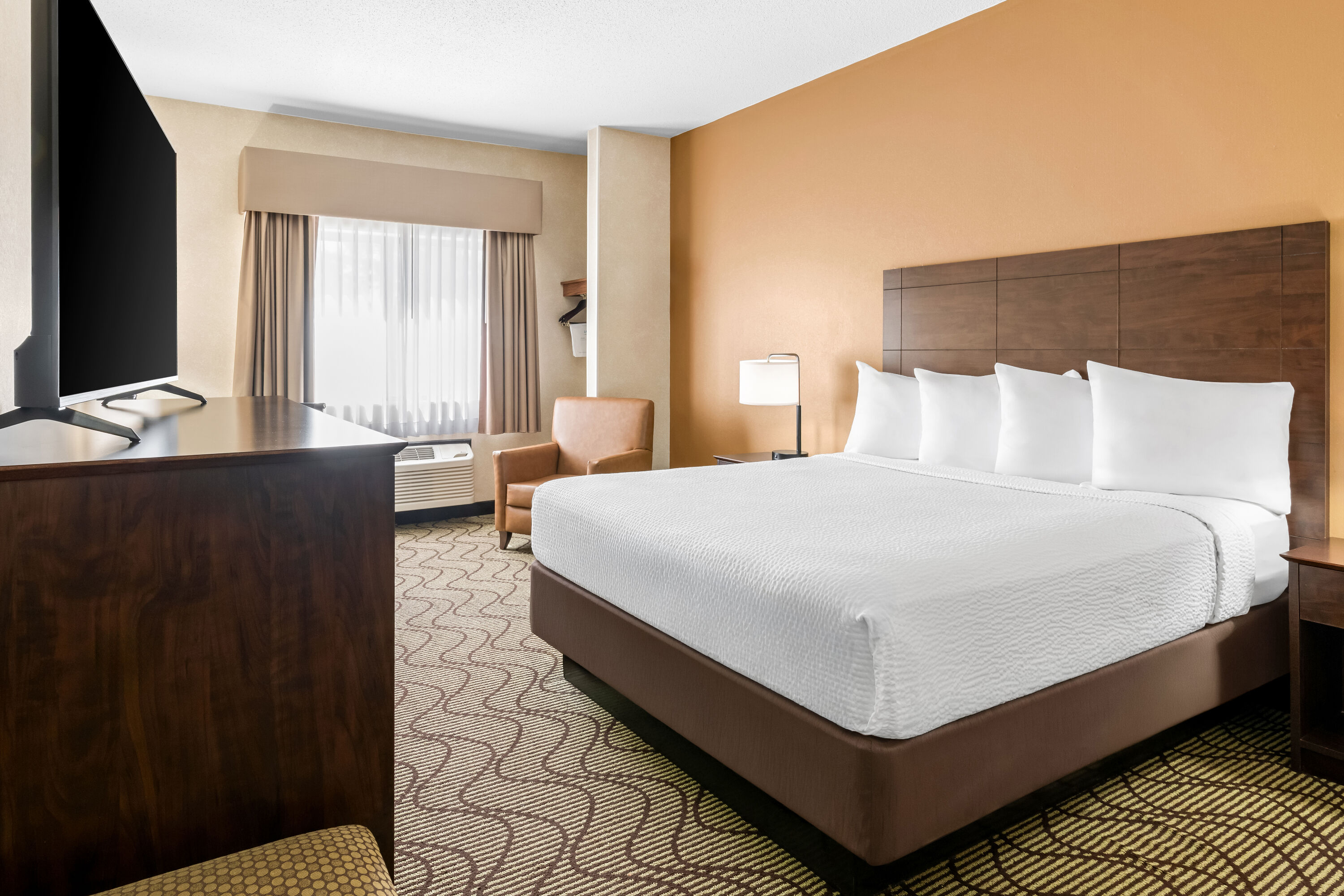 Queen bed guest room at the Days Inn by Wyndham Grand Forks Columbia Mall in Grand Forks, North Dakota