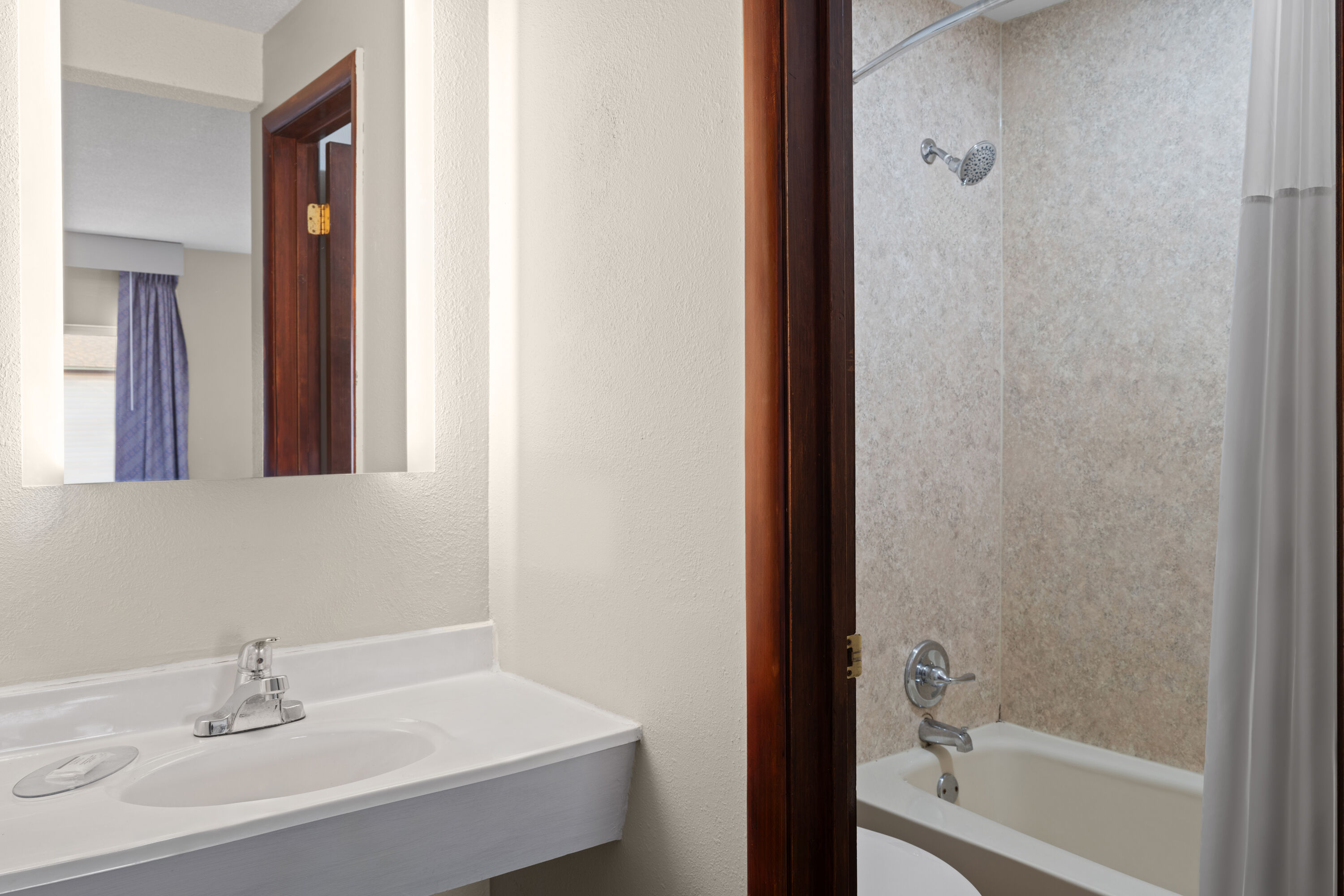 Guest room bath at the Days Inn by Wyndham Jamestown in Jamestown, North Dakota