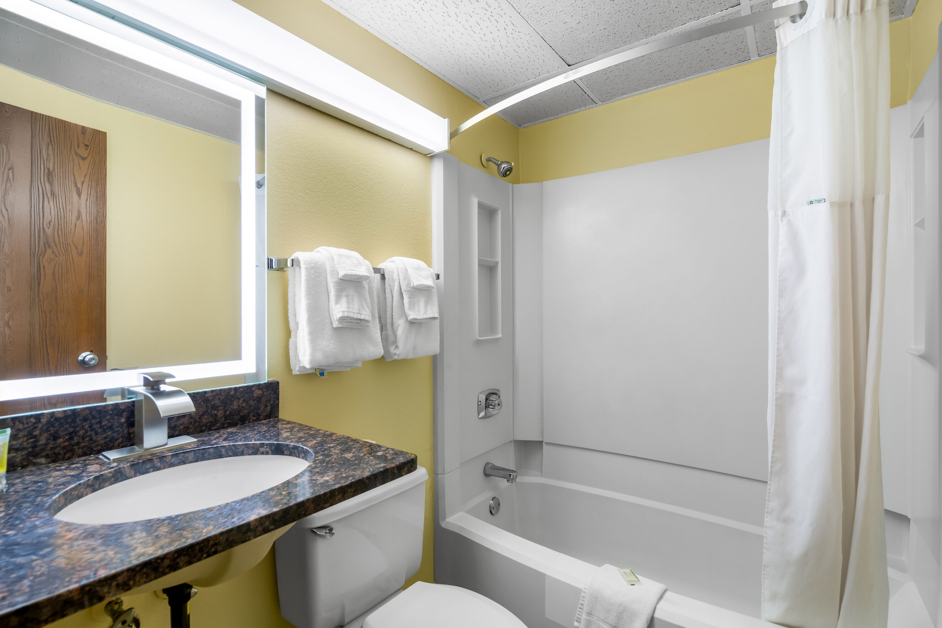 Guest room bath at the Days Inn by Wyndham Minot in Minot, North Dakota