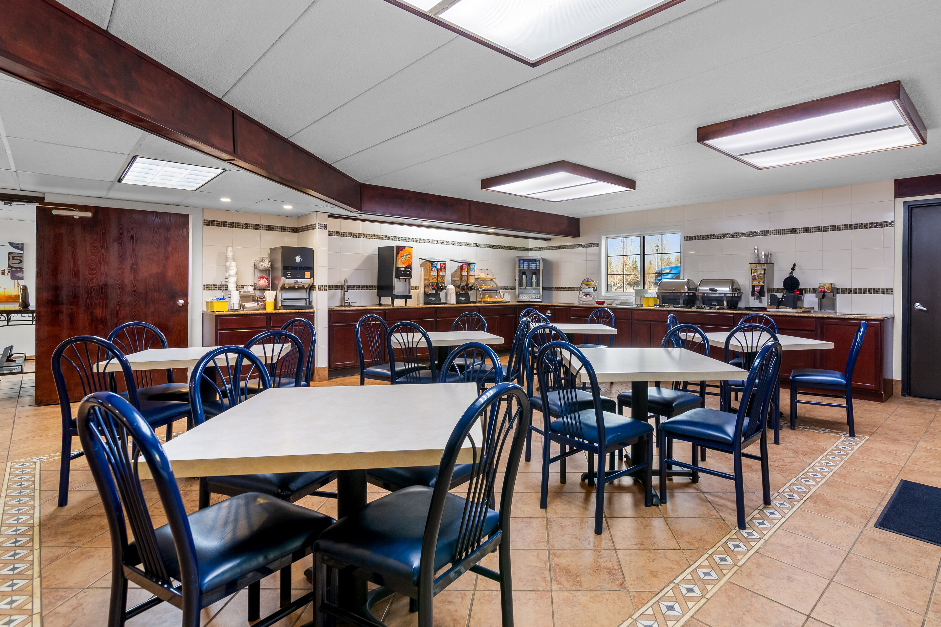 Days Inn by Wyndham Minot restaurant breakfast area with seating in Minot, North Dakota