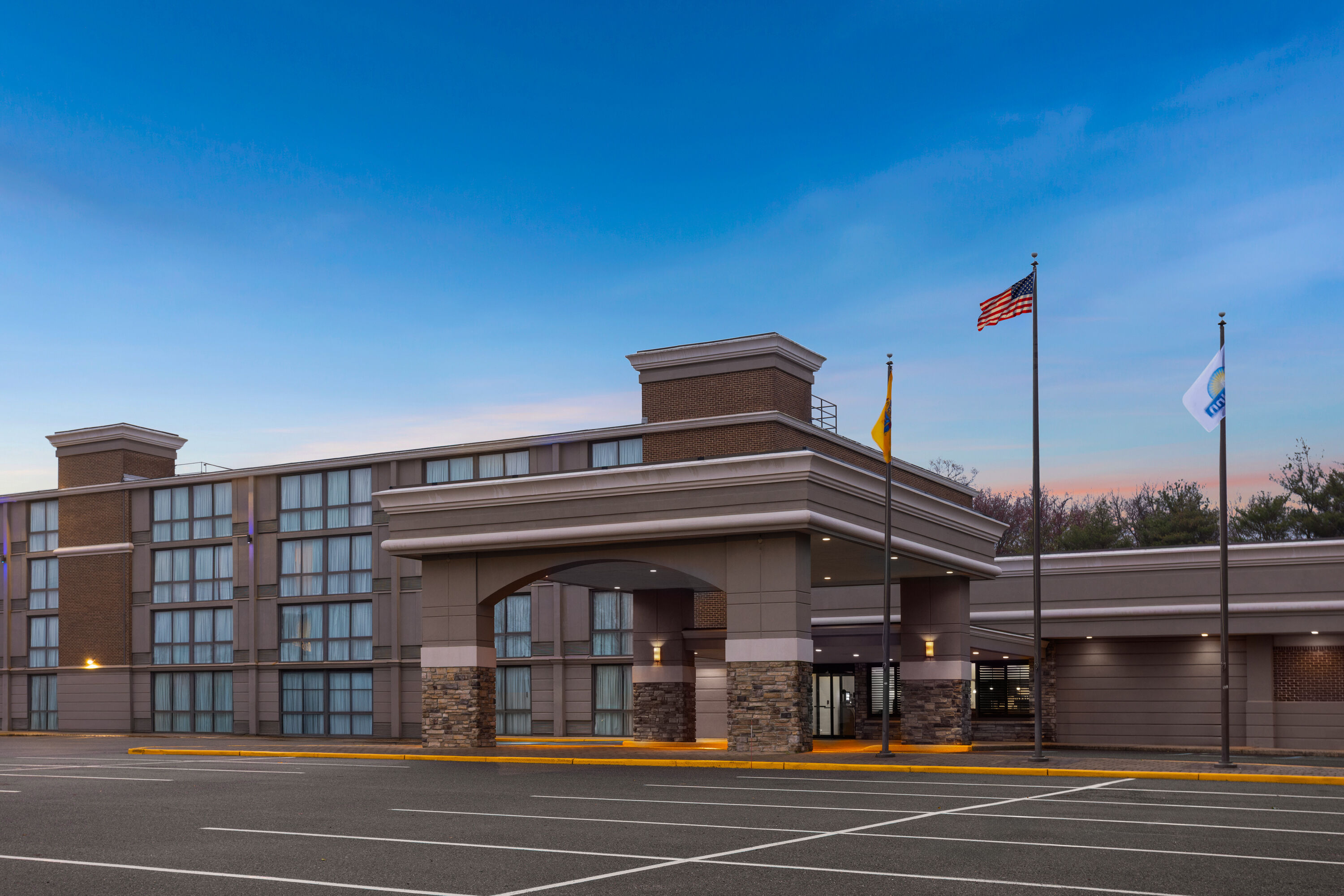 Exterior Dusk Image of Days Hotel by Wyndham Toms River Jersey Shore hotel in Toms River, New Jersey