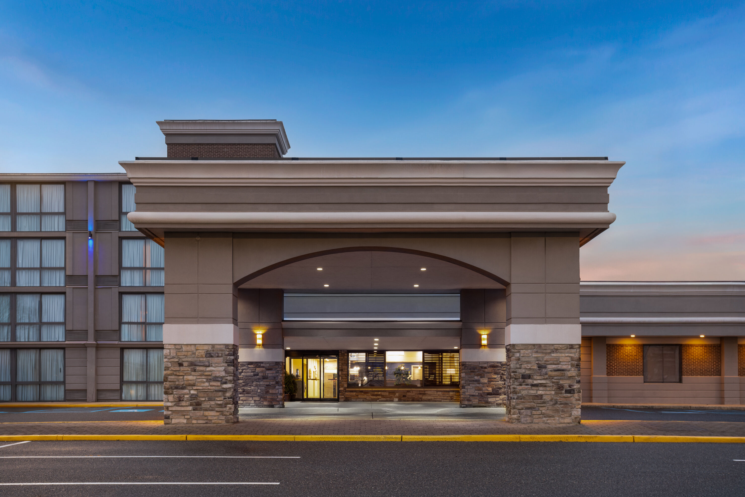 Exterior Dusk Image of Days Hotel by Wyndham Toms River Jersey Shore hotel in Toms River, New Jersey
