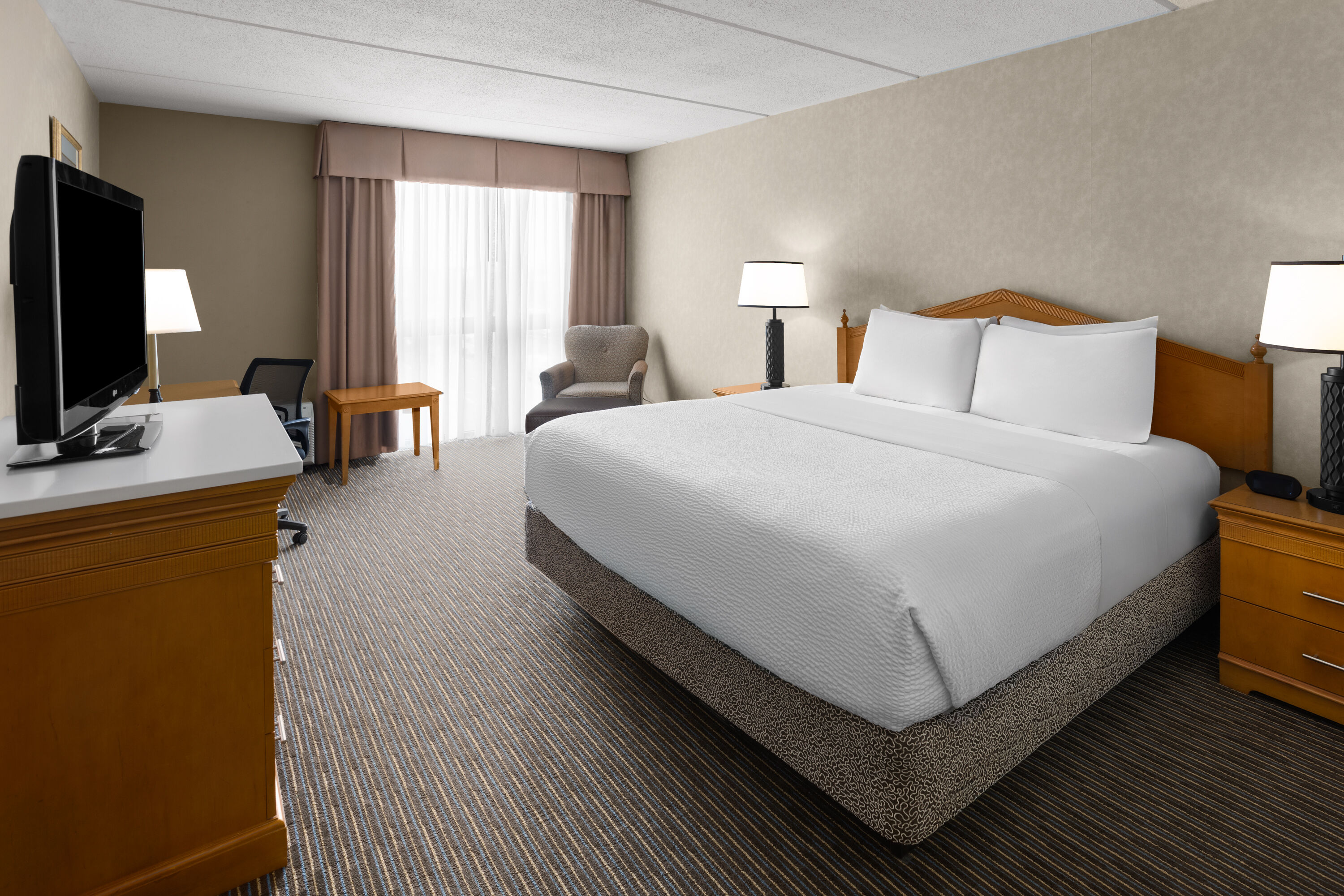 Guest room at the Days Hotel by Wyndham Toms River Jersey Shore in Toms River, New Jersey