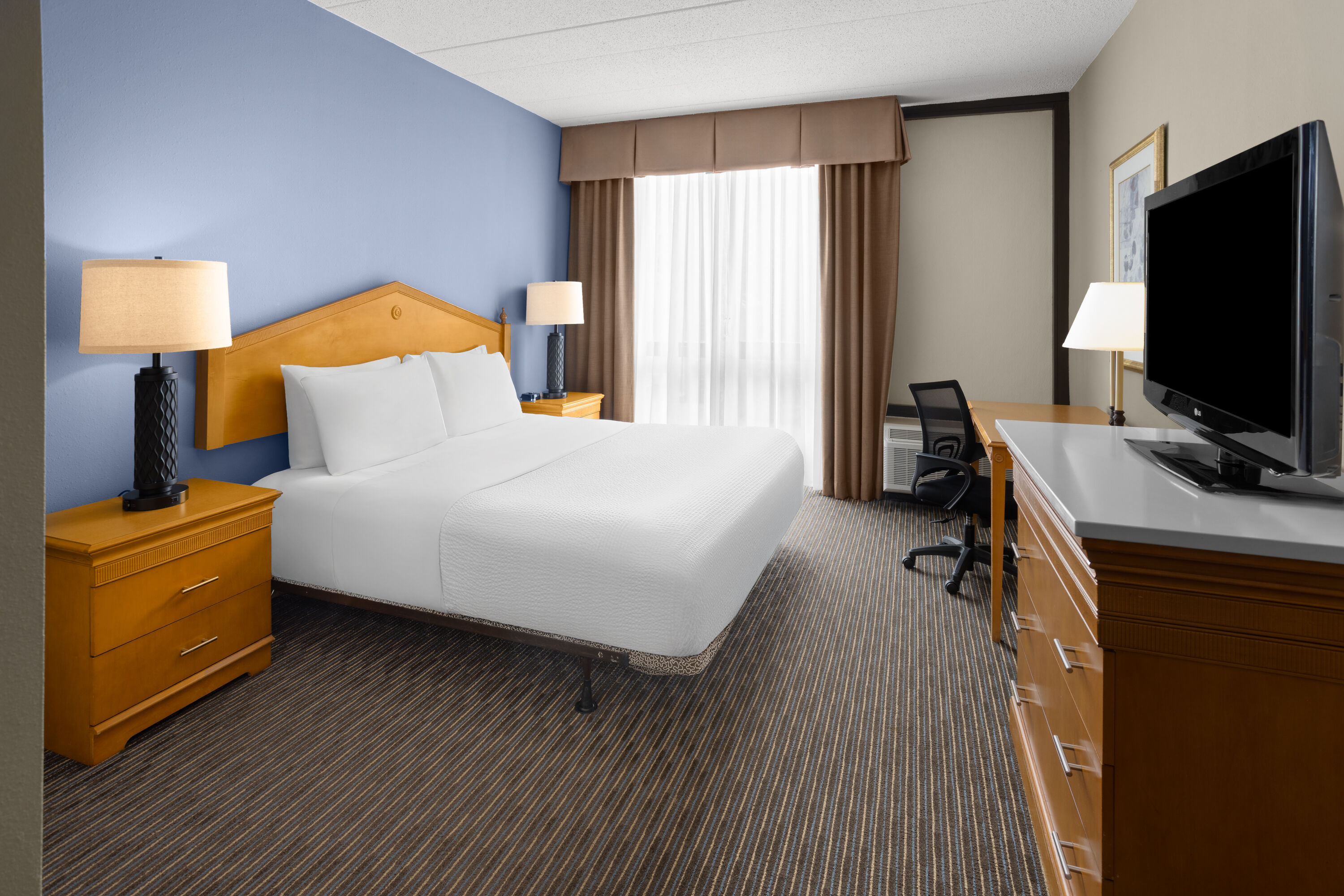 Guest room at the Days Hotel by Wyndham Toms River Jersey Shore in Toms River, New Jersey