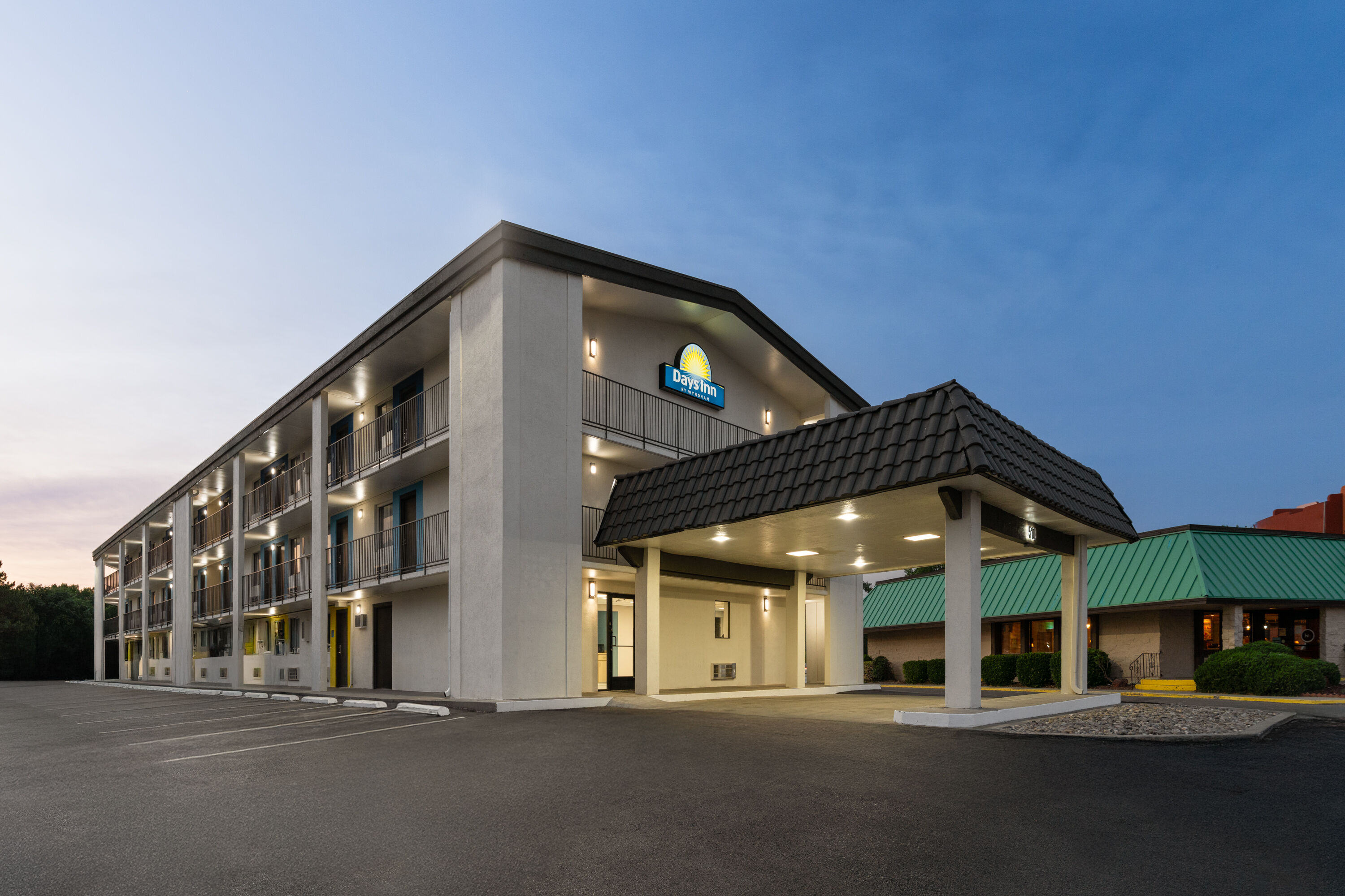Exterior Dusk Image of Days Inn by Wyndham Farmington NM hotel in Farmington, New Mexico