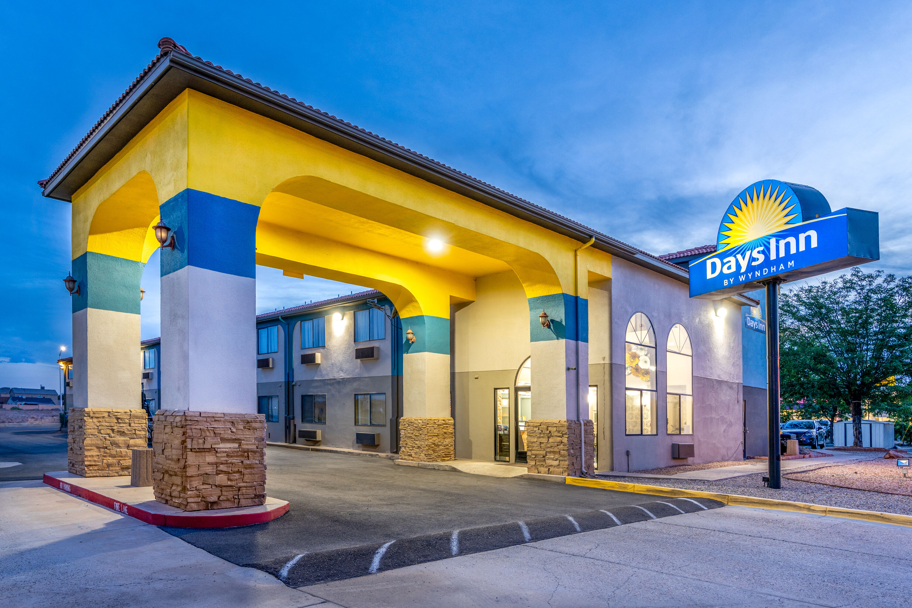 Exterior Dusk Image of Days Inn by Wyndham Los Lunas hotel in Los Lunas, New Mexico