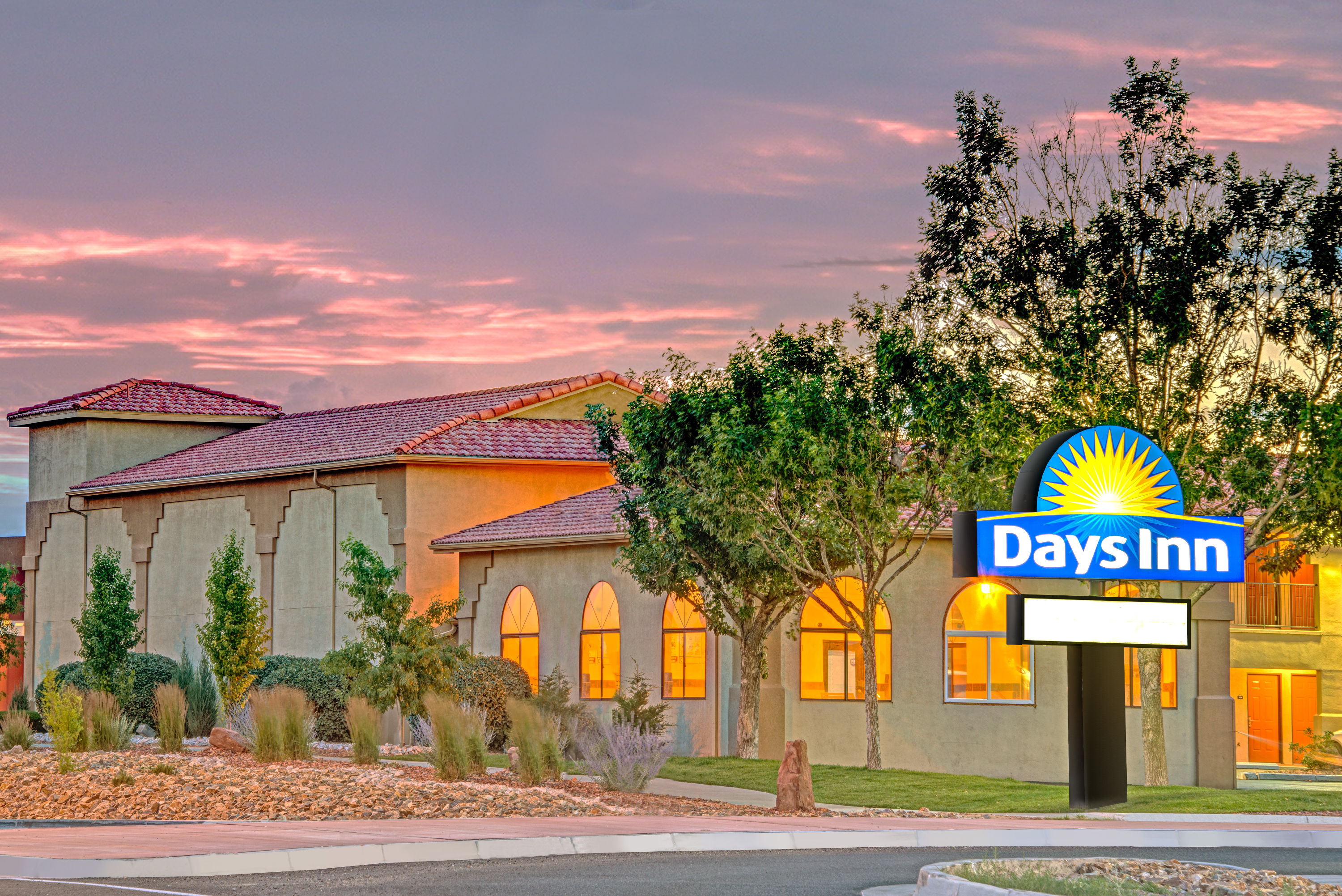 Exterior Dusk Image of Days Inn by Wyndham Rio Rancho hotel in Rio Rancho, New Mexico
